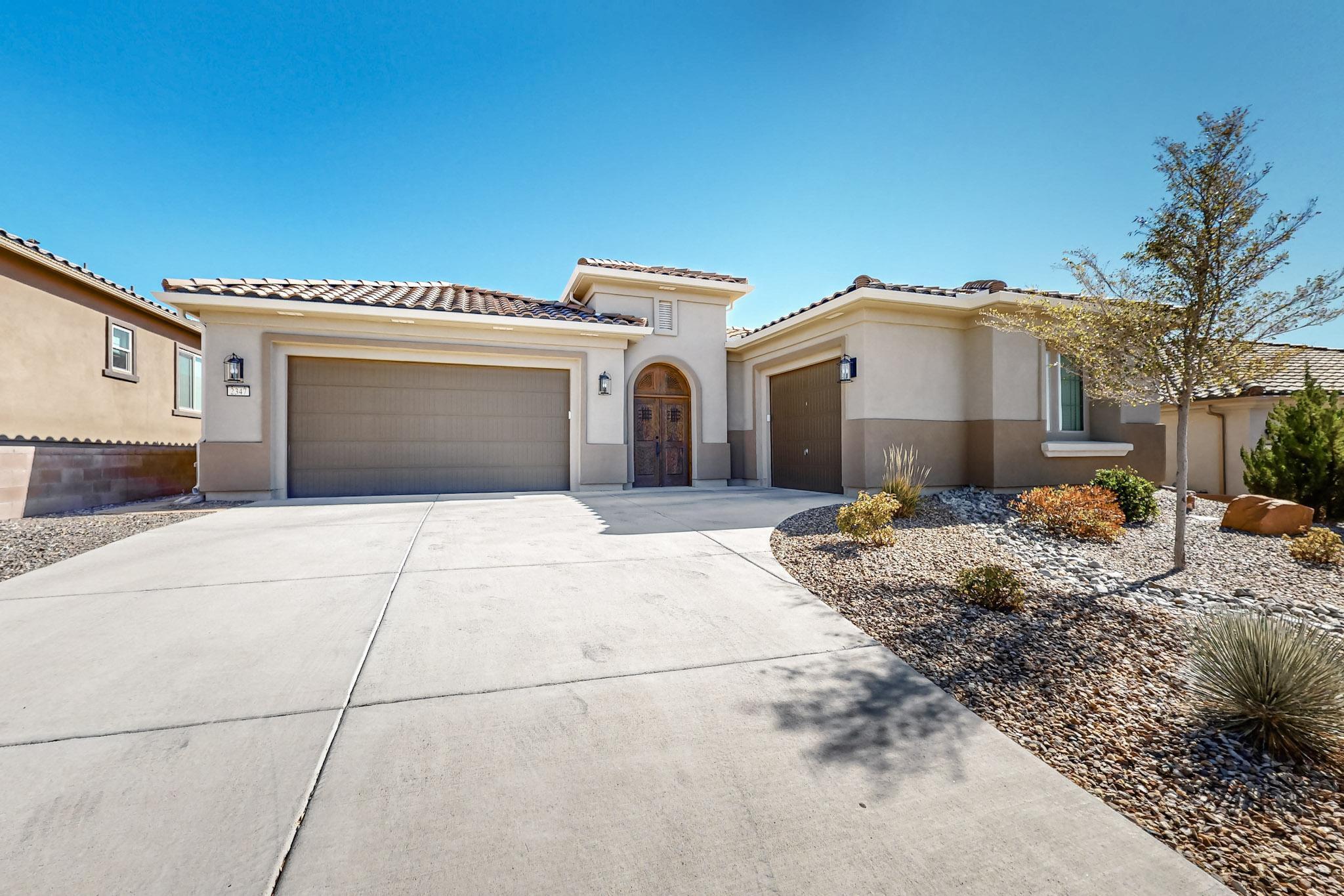 Nestled in a serene, quiet, active adult community.  The private courtyard welcomes you to this exquisite home that offers an open floor plan bathed in natural light, creating an inviting and warm atmosphere. The gourmet kitchen, featuring high-end appliances, is a chef's dream, perfect for culinary creations and entertaining. With two luxurious primary suites and soaring raised ceilings throughout, comfort and elegance are paramount. Enjoy year-round outdoor living with a fully equipped kitchen and covered space ideal for entertaining. Scenic walking paths wind through the neighborhood, while easy access to major thoroughfares ensures convenience at every turn. Enjoy relaxing, socializing, or exercising  at the Sandia Amenity Center year around.  A truly exceptional residence.