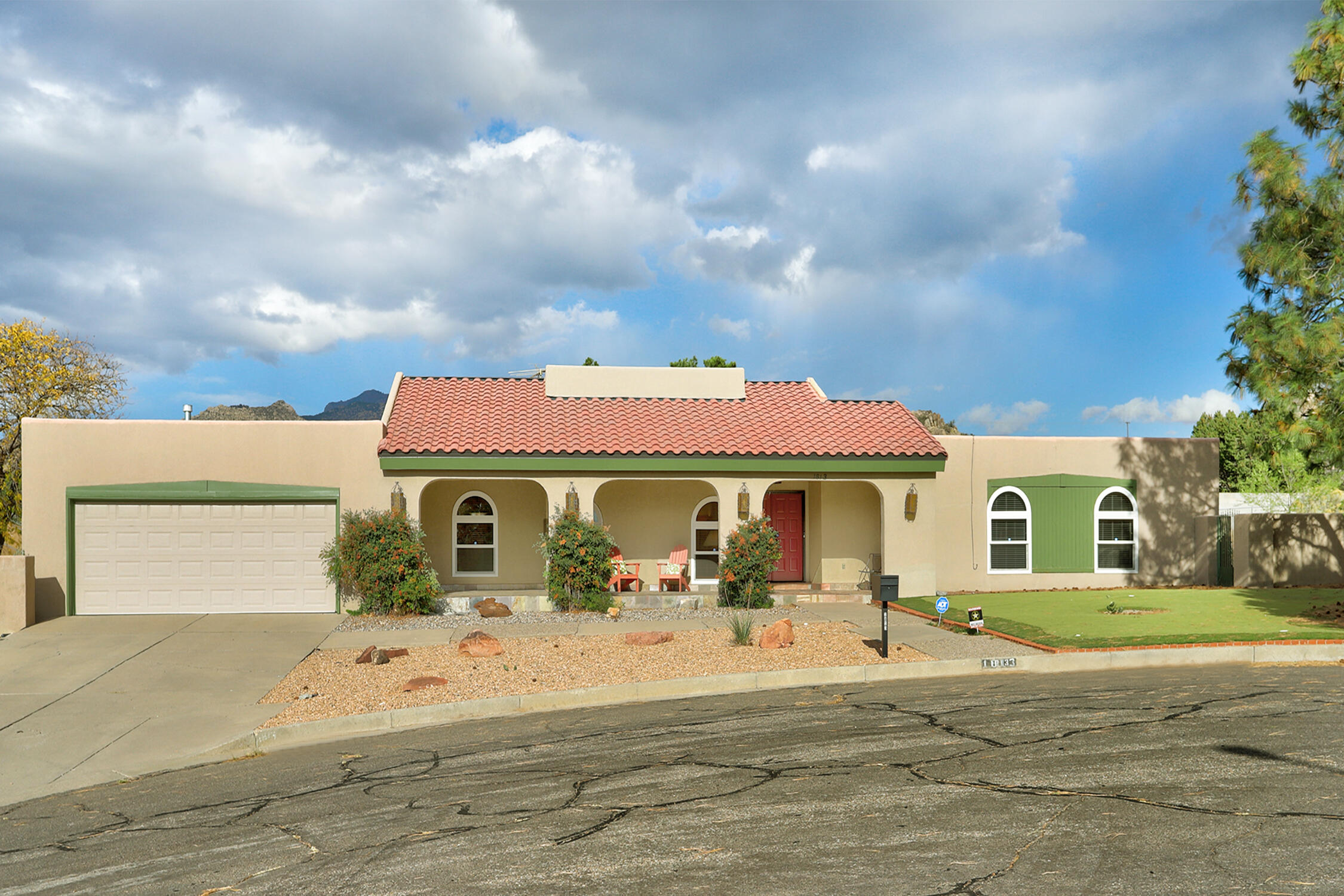 Four Hills Golf Course Community is the setting for this Casually Elegant, sprawling, 3551+ sq ft, single level ranch style home located in a cul de sac, one lot from Manzano open space trails! This Original Owner home has had all the important functional updates completed; updated furnace/AC, water heater, roof, windows, Travertine tile flooring (no carpet!), 2 of 3 showers updated, patio pavers and slate tile, etc., (see info in MLS Docs). The floorplan showcases 4 or 5 bedrooms (could have 2 primary suites, one on each end of the home) perfect for multi-generational living! Enclosed back porch - great studio! 0.65 Acre Lot w/large side yard perfect for a future pool and additional garage!