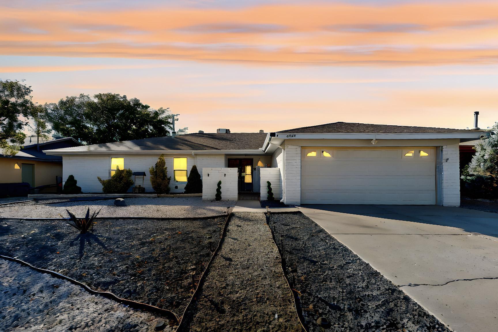 A spacious four-bedroom, two-bathroom home located in NE Albuquerque. This property features a kitchen with a bar, two living areas for comfort and versatility, and a backyard designed for entertaining. The outdoor space includes a pool, grassy area, covered patio, outdoor bar, grill, storage shed, and a walled perimeter for added privacy and security, making it perfect for both family living and hosting gatherings.