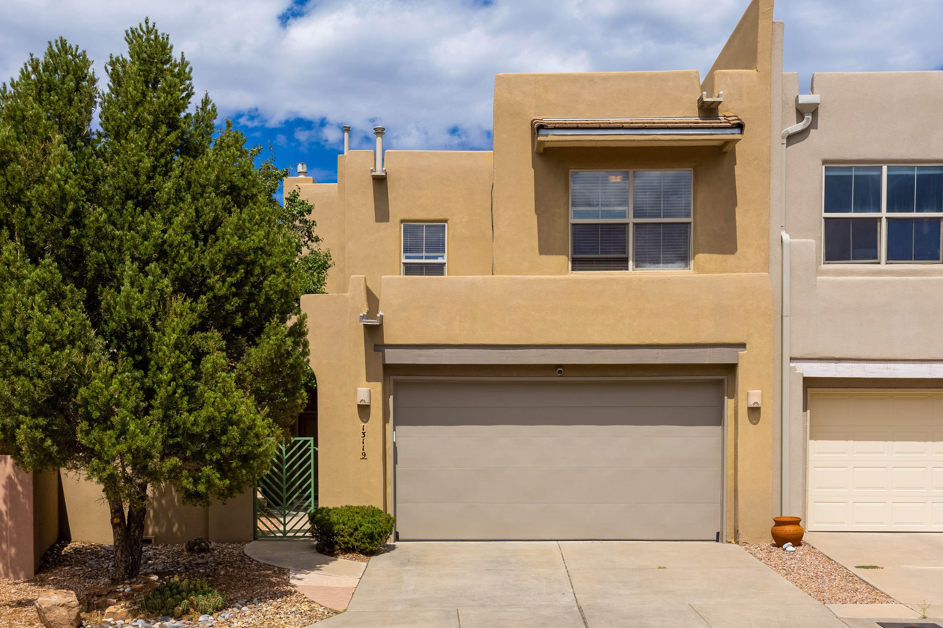 Light, Bright, & Open Home in a Gated Community in coveted High Desert! Wonderful Vibes & Natural Light thanks to a Ton of Windows, offering a Beautiful Display of a Lovely Patio & Grounds downstairs & Sweet Panoramic Mountain & Valley Views from up! Nicely Placed on a Cul-De-Sac lane, Enjoy the Security & Lock & Leave benefits of Gated Access plus Low Maintenance Landscaping. Open Living & Kitchen with Convenient Island provide Great Spaces for Family & Entertaining Mingles! Easy Access to the Inviting Back Patio. Primary Suite with Sandia Mountains from your Pillows. Laundry Upstairs, smartly near all Bedrooms. Newer TPO Roof & Water Heater. Next door to High Desert Park & close to National Forest Hiking/Biking Trails. All Appliances Convey. Well Maintained, Turn-Key, & Move-In Ready!