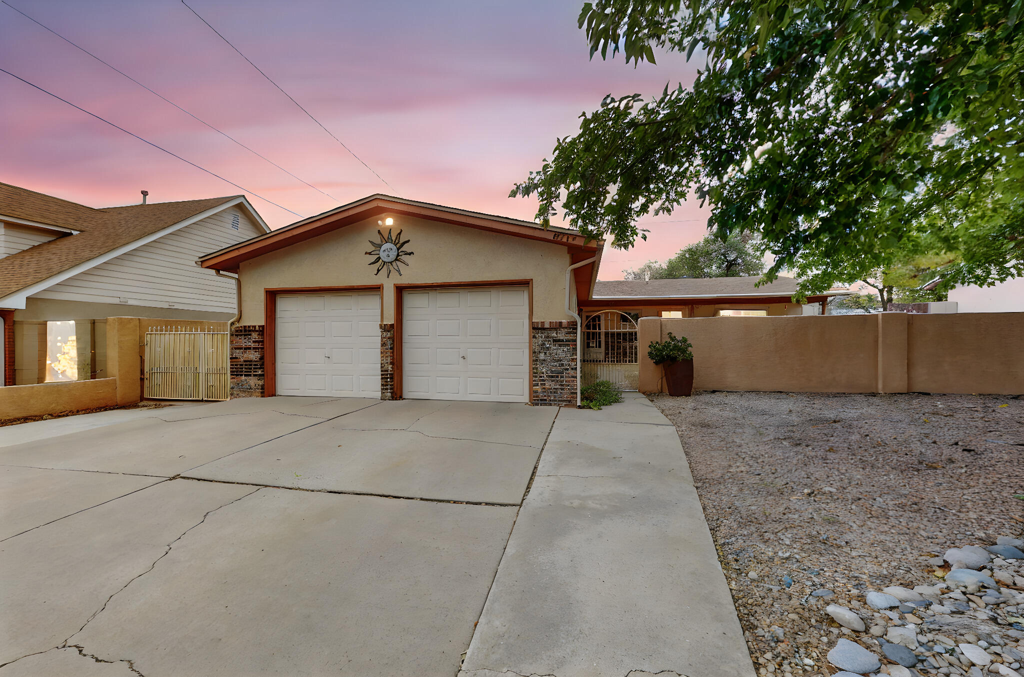 This is a lovely 3 bedroom, 2 bathroom home in a great location!  Kitchen is fully updated and features beautiful countertops and cabinets, a 6 burner gas stovetop, convection oven, microwave, and new dishwasher.  Primary bedroom with 3/4 bathroom, newer walk in shower!  Most of the home has been freshly painted!  NO carpets, floors are tile, bamboo & laminate (which is pet & water proof & has a sound barrier below)!  Additional bonus appliances are a washer, dryer and freezer in the garage! Private front courtyard is lovely includes water feature (needs a pump).  Back yard access on the west side of the home!  Back yard features large covered patio with roll out blind, 2 sheds, one with electrical power.  All landscape on drip system.  Attached 2 car garage is over sized, auto openers