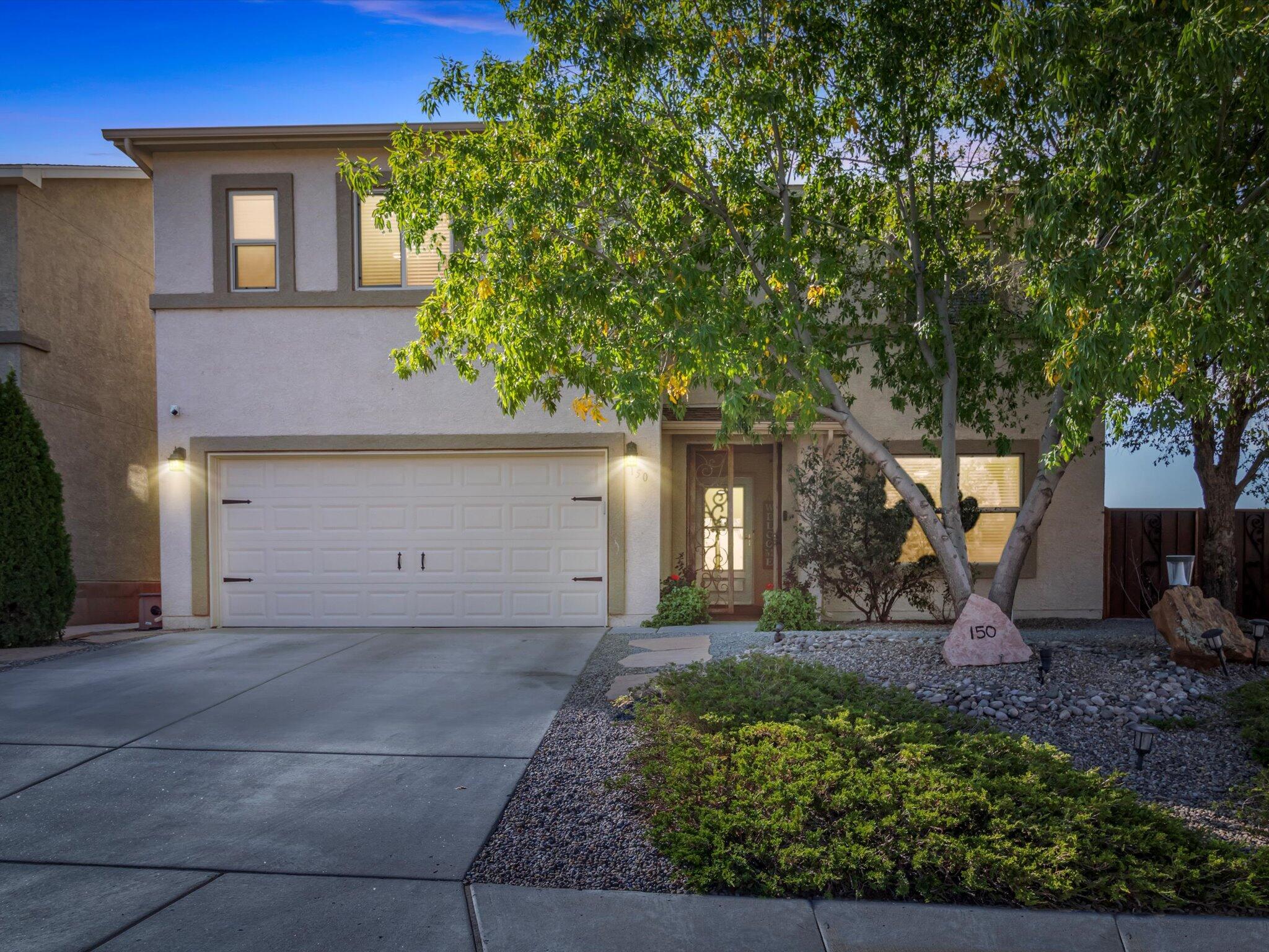 Welcome to this stunning 5-bedroom, 3-bathroom home in the heart of Rio Rancho, New Mexico! This beautifully maintained property offers a blend of elegance and comfort, featuring upgraded tile flooring on the first floor and brand-new carpet upstairs. The spacious main-level suite provides easy access and privacy, perfect for guests or family members. The home sits on a fully landscaped lot, adorned with mature trees and a lush, picturesque backyard--ideal for relaxing or entertaining. Located near parks, top-rated schools, and convenient shopping, this home combines a prime location with modern upgrades and well-thought-out details. Don't miss your chance to own this lovely property!