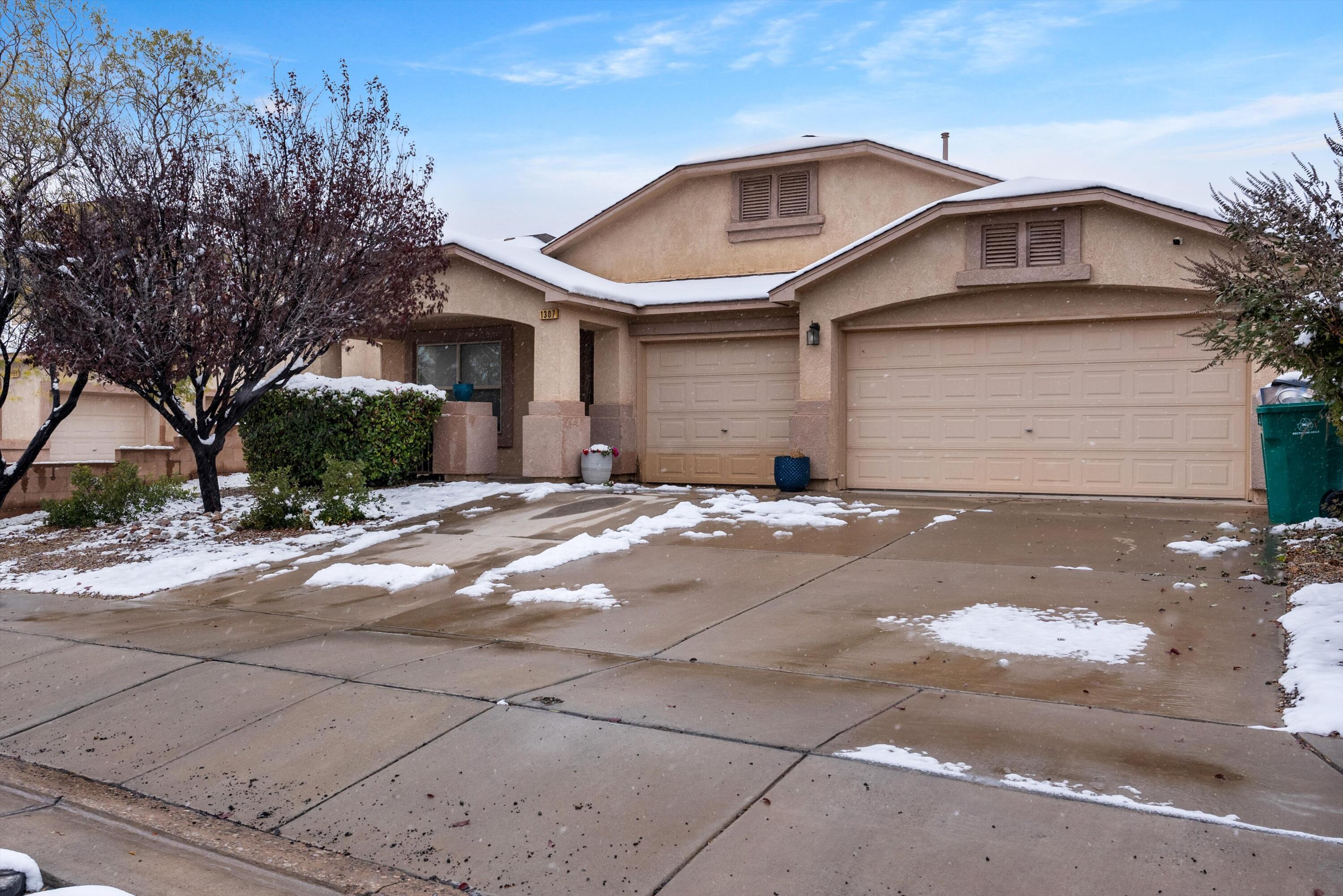 Welcome to this rare single-story gem, offering 3 spacious bedrooms, 2 baths, and a coveted 3-car garage. This home is designed with entertaining in mind, featuring two distinct living areas, including a formal living and dining room. Enjoy the open concept great room that flows seamlessly into the kitchen and breakfast nook. The kitchen boasts a center island, abundant cabinetry, and a large pantry for all your storage needs. Relax in the expansive master suite, complete with dual walk-in closets, a cozy fireplace, and an en-suite bath with a separate shower and soaking tub. Additional highlights include a second fireplace, a covered patio with stylish rock landscaping, and refrigerated AC for year-round comfort. This home is the perfect place to make lasting memories!