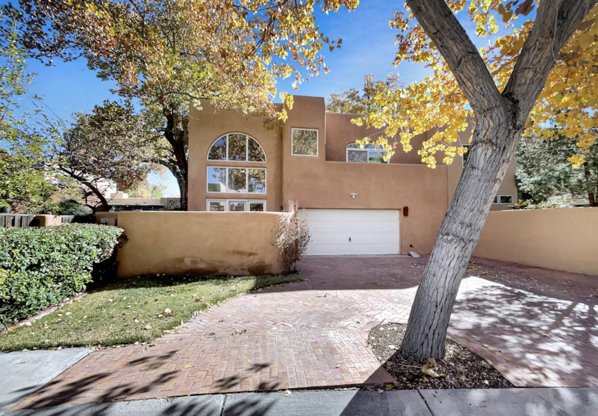 Welcome to this beautifully maintained property, boasting a cozy fireplace that adds charm to the living area. The neutral color paint scheme throughout provides a calming ambiance and makes for easy decorating. The kitchen shines with an accent backsplash and all stainless steel appliances for a modern touch. The primary bathroom is a true retreat with double sinks, a separate tub, and shower for a spa-like experience. The primary bedroom features a spacious walk-in closet, and partial flooring replacement has been done to ensure a fresh look. Come and discover this gem, it's a property that truly feels like home.