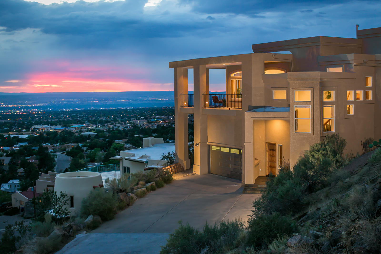 VIEWS! Experience life as if you are on top of the world from this stunning custom home located in GLENWOOD HILLS! From the impressive elevated entry featuring pebble accents entering into the living area w/ a gorgeous Venetian plaster wall. The wall of windows showcasing the impressive VIEWS showcases the remodeled kitchen by Poulin, boasting upgraded stainless steel appliances induction cooktop, & versatile island. The Primary offers a large closet with high ceilings as well as a skylight and racks above and below. You will be captivated by the expansive wraparound deck, with room to entertain many. This remarkable property combines luxury, and functionality, perfect for enjoying modern living with PANORAMIC/MILLION DOLLAR VIEWS! Solar completely paid for.