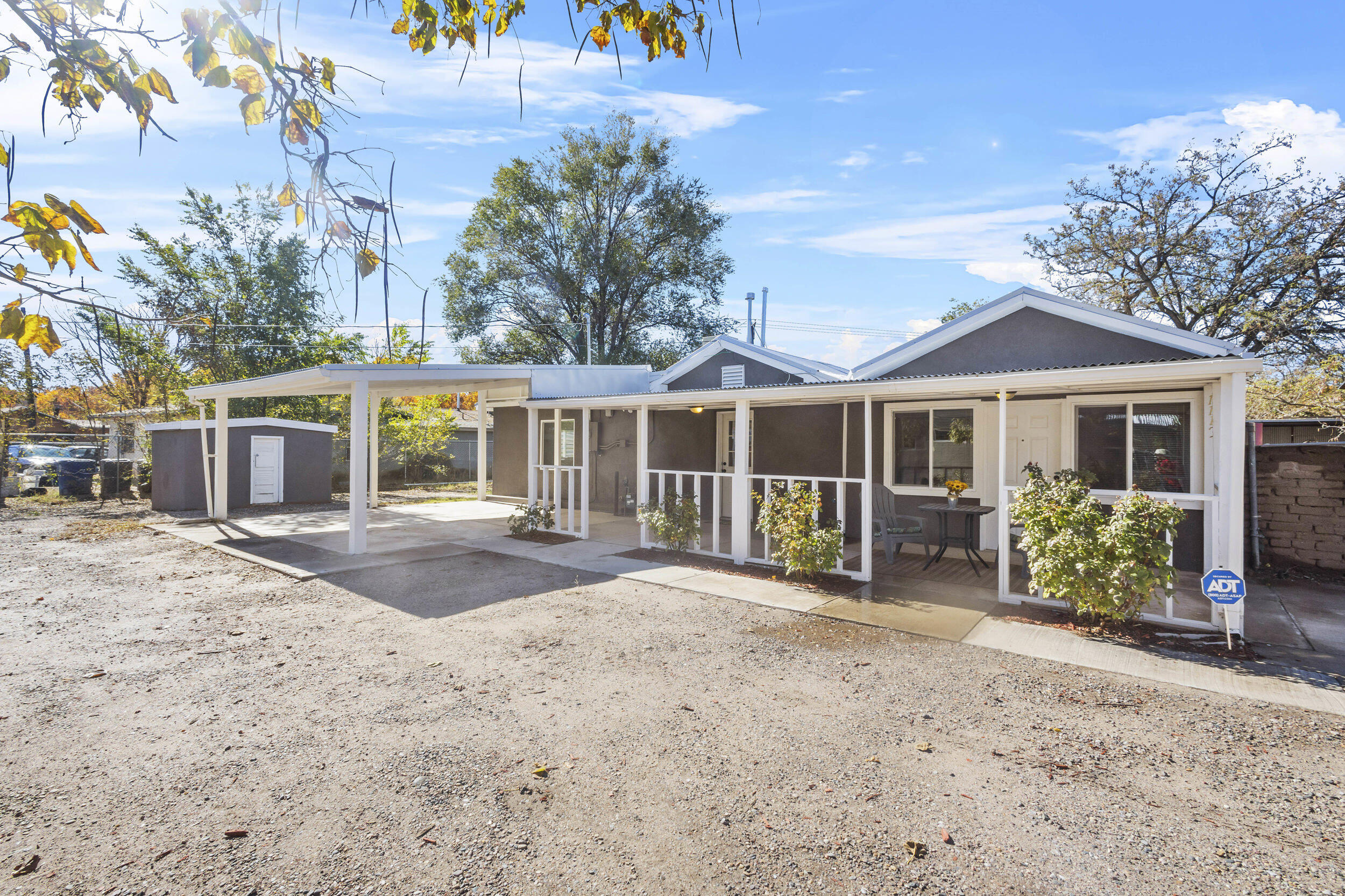 Price Drop! Equity, Equity!! Tucked away from the main road, this home offers the privacy you desire while being located in the heart of Barelas/Downtown area. It's very near the ABQ Zoo, and offers easy access to walking and biking trails along the Rio Grande river. The property features an additional natural gas line and extra lot space, perfect for a potential income-producing project. Beautifully remodeled 3BR, with office, 2BA home retains the charming feel of the adobe style build. The kitchen boast a stunning backsplash that adds an artistic touch, while new windows flood the space with natural light, enhancing the bright and cheerful ambiance created by the two-toned paint. The large laundry room doubles as extra storage.