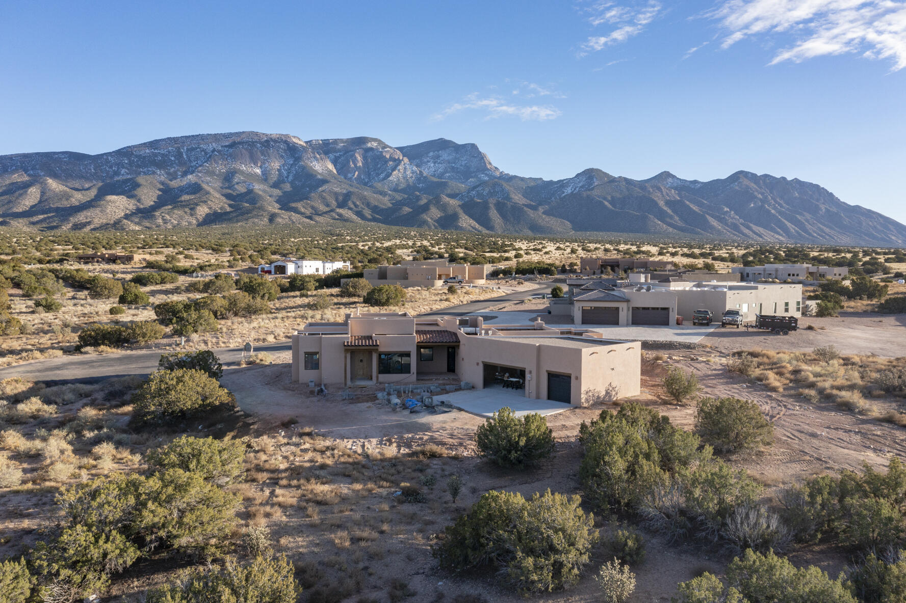 UNDER CONSTRUCTION-Completion soon. Upscale new construction in Apache Mesa. Single story (no steps) w/3 bedrooms (2 suites), office, 3 baths & oversized 3-car garage with Sandia & Jemez Mtn views. Chef's kitchen w/KitchenAid appliances, large island, butler's pantry w/beverage cooler & walk in pantry. Radiant heat+2 combo refrig air/heat units*wood floors*venetian plaster walls*8 foot knotty alder interior doors*Jeld-Wen Auralast windows/doors*Velux skylights*wood beam ceilings*2 gas fireplaces* 3000 PSI concrete*slab/foundation reinforced w/#3 Fiber rebar*R49 blown-in insulation (ceiling)*R23 (walls)*R19(garage)*air infiltration @doors/windows/sill plates*fire suppression system. Apache Mesa borders Cibola National Forest w/endless outdoor trails & close to The Merc & shopping!