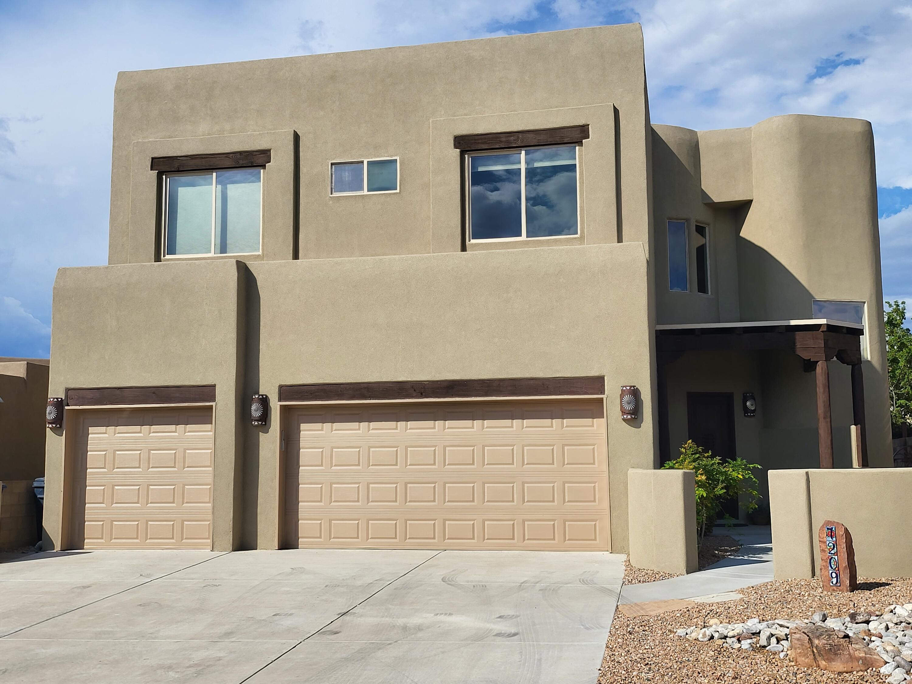 This stunning home in the Desert Ridge Trails South Subdivision is a must-see! Recently updated with brand-new stucco, a TPO roof, fresh paint, and new carpet, it offers a modern and refreshed feel throughout. The new refrigerated AC unit ensures year-round comfort, while the beautifully landscaped backyard provides a serene retreat, backing up to open space with breathtaking Sandia views. The home also features an epoxy-finished three-car garage, combining functionality with a polished look. With its upgrades and unbeatable location, this home is ready to impress--schedule your private showing today!