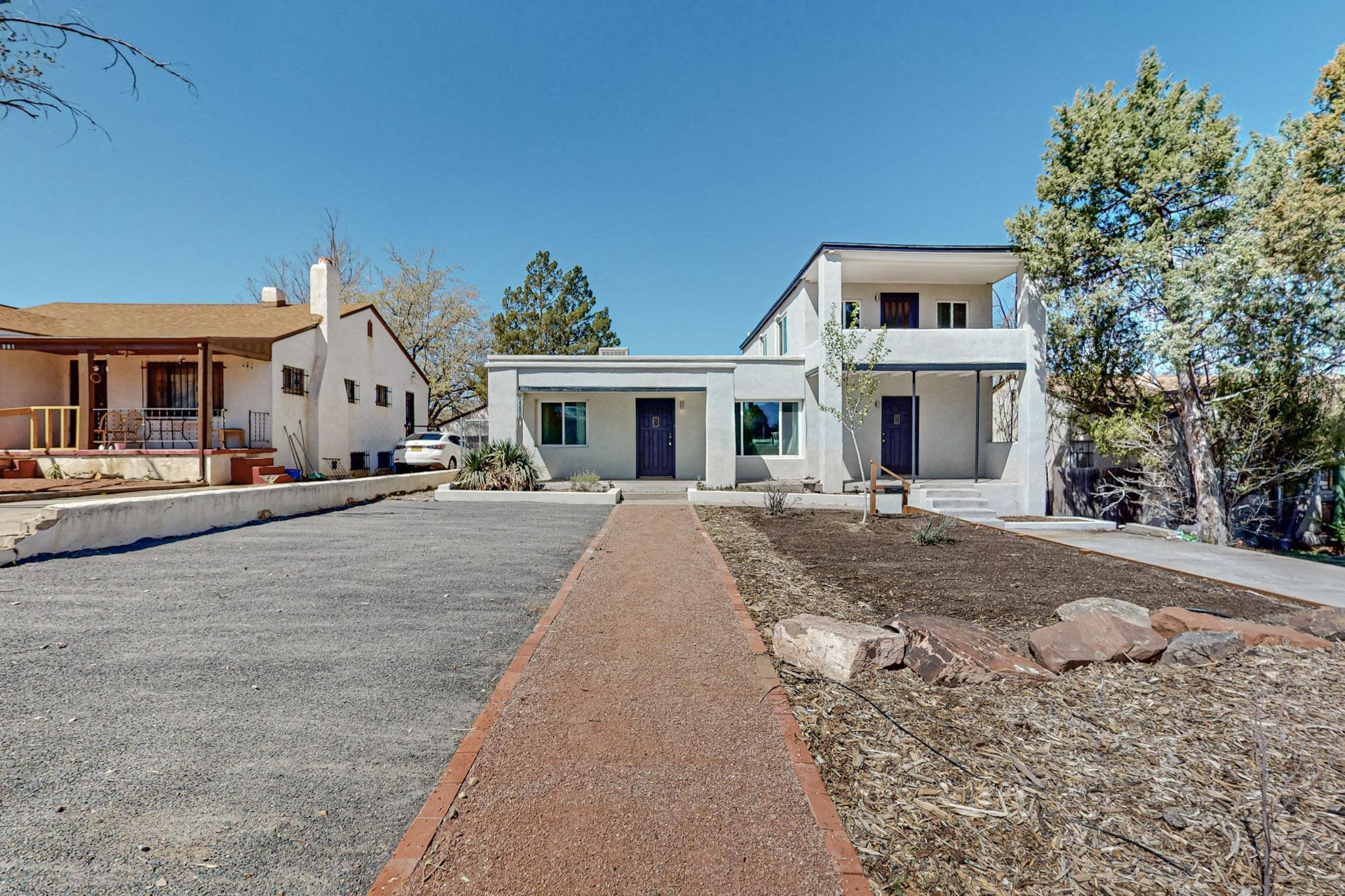 Charming Nob Hill Home with Versatility and StyleNestled in the heart of Nob Hill, 211 Amherst Dr SE is a rare gem offering both charm and flexibility. This beautifully updated property can serve as a spacious single-family home or as a lucrative duplex. Featuring 4 bedrooms and 3 bathrooms, it boasts original wood floors, a remodeled kitchen and bathrooms, updated electrical systems, and new windows. Ductless split systems throughout ensure modern comfort.The second unit has been meticulously remodeled and includes its own private balcony with stunning views--an exceptional find in Nob Hill. Whether you're seeking a family home or an investment opportunity, this property has it all.