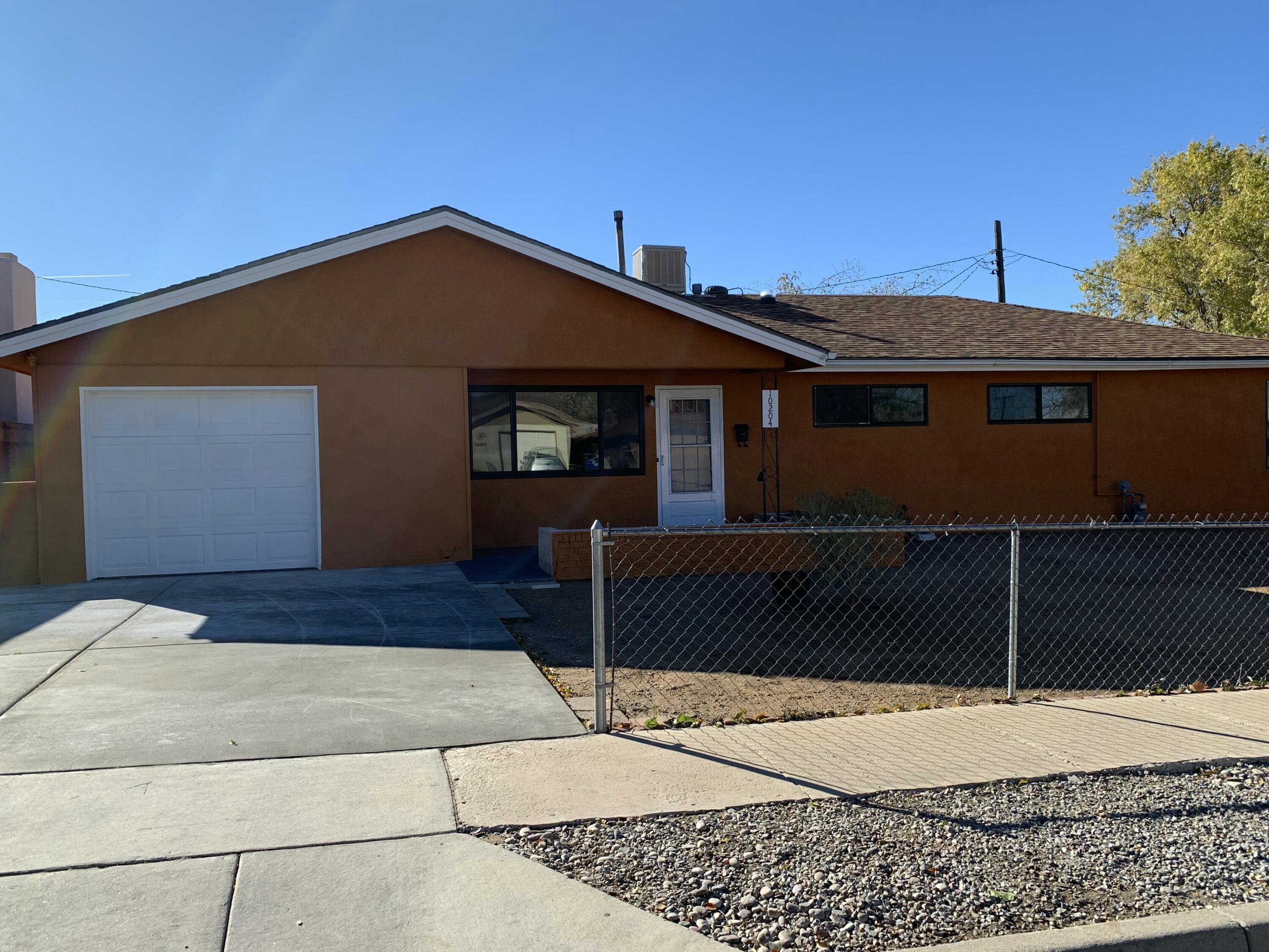 Discover this Beautiful home in Albuquerque's Desirable Northeast Heights! Featuring 5 bedrooms and 2 full  bathrooms, this property is the perfect blend of space and function. The layout includes multiple living areas, offering flexibility for entertaining or quiet retreats. A main level primary suite provides privacy and comfort with a separate shower. The kitchen is well- equipped with a dishwasher, free-standing electrical range, and refrigerator. Skylight, ceiling fans, and natural gas heating enhance the home's cozy atmosphere, while evaporative cooling keeps it comfortable in the summer. Don't miss the opportunity to call this property home- schedule a showing today!