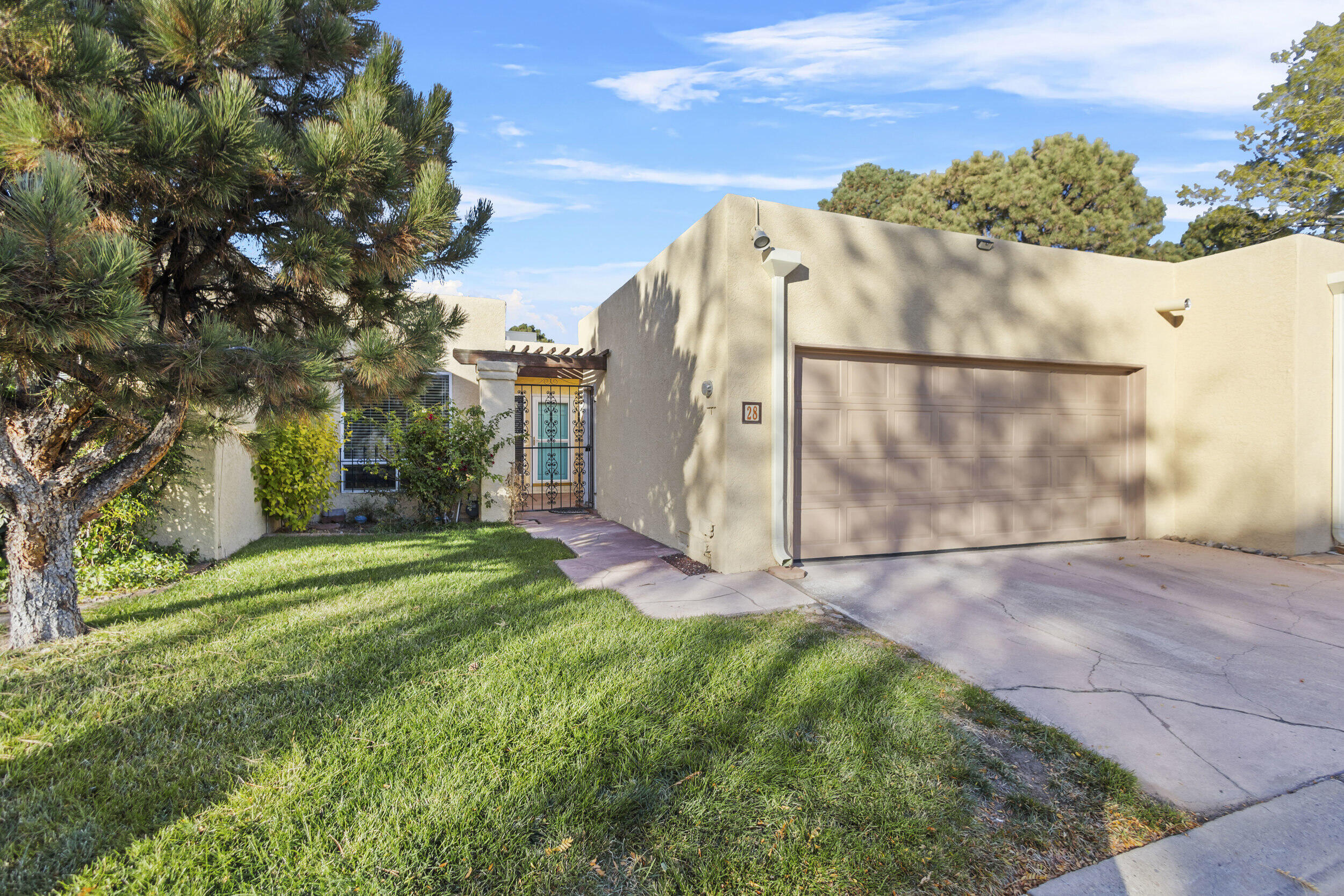 Discover this easy-to-maintain 2-bedroom, 2-bathroom patio home located just minutes from the Arroyo Del Oso Golf Course. Recently updated with fresh paint, a new roof, and a brand-new HVAC system, this home is move-in ready! The open floorplan boasts soaring ceilings in the living room, allowing for plenty of natural light to flood the space. Enjoy both front and rear patios, perfect for relaxing or entertaining. Nestled in a beautifully maintained community, you'll have access to a sparkling pool and the added convenience of HOA-provided services, including front landscaping and some exterior maintenance. Whether you're looking for a peaceful retreat or a lock-and-leave lifestyle, this home checks all the boxes. Don't miss the chance to make this gem your own!