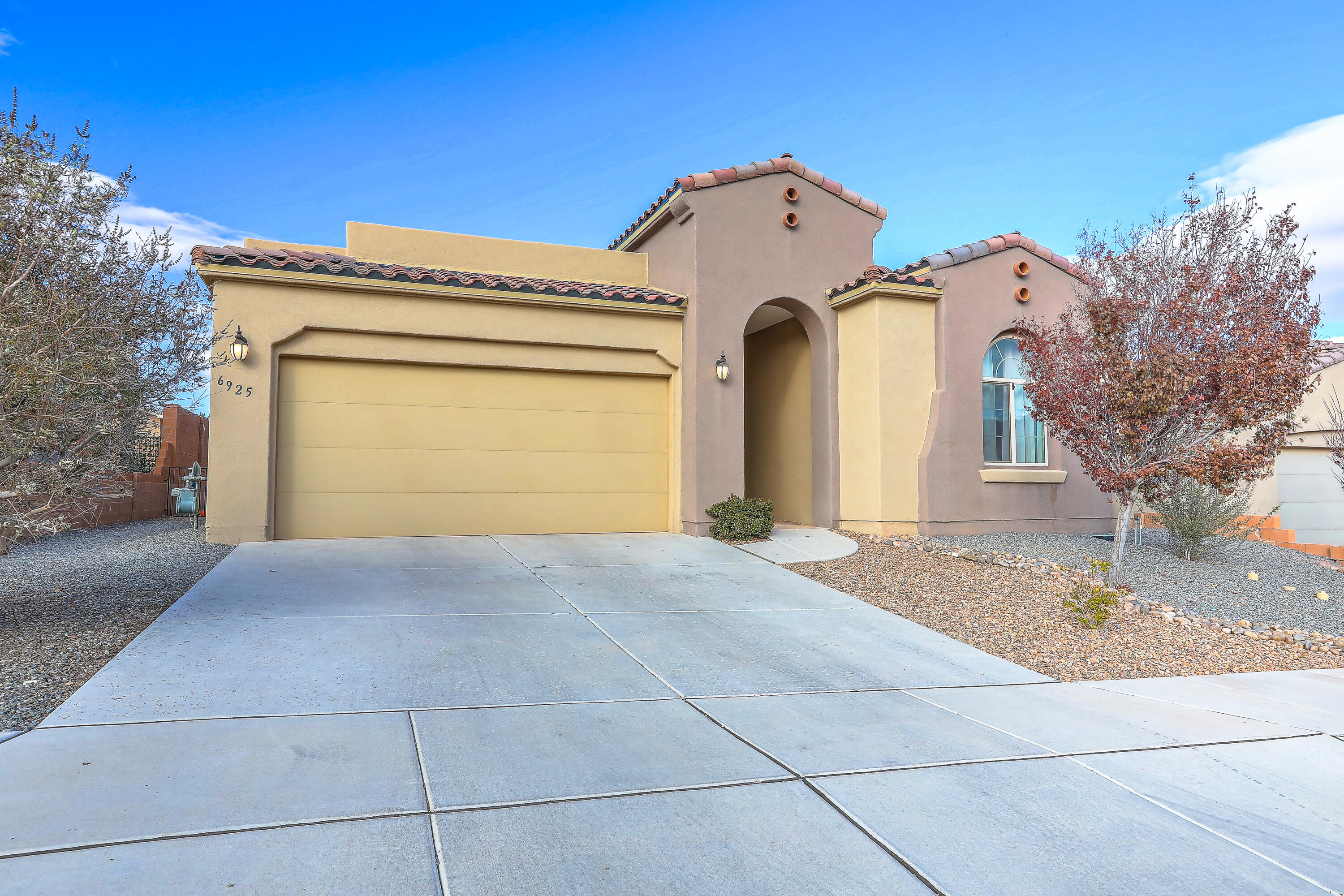 This beautiful single story hm features a bright & open floorplan w/4 spacious bedrooms, walk-in closets & 4th B/R use could be perfect for office or playroom plus 2.5 baths. The modern kitchen boasts a large center island w/seating, gas cooktop w/decor stainless hood, custom cabinets & is open to the spacious dining area making it ideal for casual dining or entertaining. Greatroom w/custom Trayed ceiling is light & bright w/lots of windows & gorgeous built-in blinds. Rich wood-look tile flooring runs throughout w/carpet in B/R's adding warmth & elegance. The primary suite offers a peaceful retreat with a stunning ensuite bath. Front & back landscaping w/oversized back patio, lush green grass w/auto sprinklers + trimmed in drip system. Located close to just about everything!