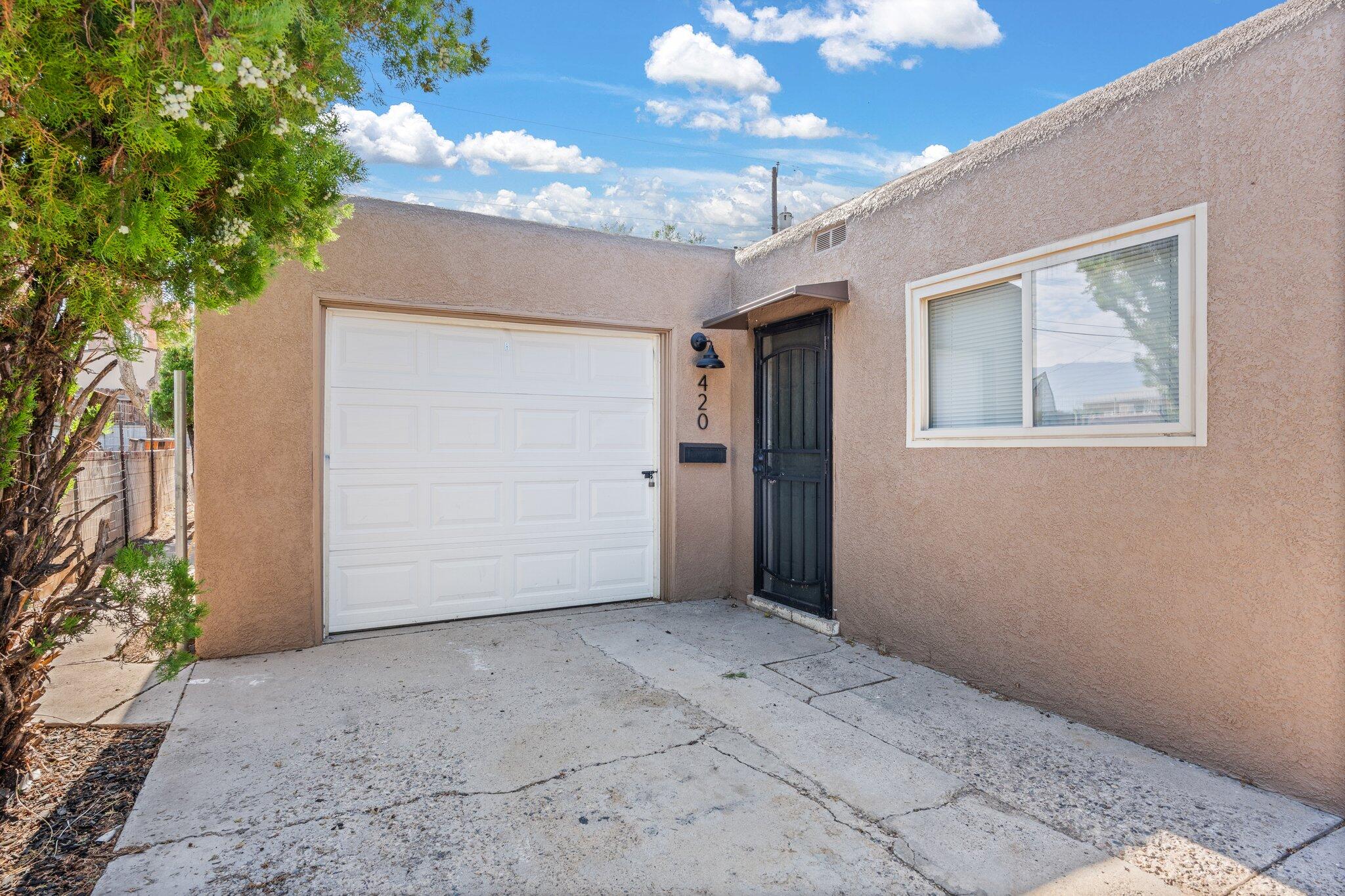 Beautifully remodeled with new roof-ready to rent!  This lovely duplex has two bedroom units with one bathroom and one car garage for each side!  Washer and dryer hookups in each unit.  New flooring throughout, fresh paint, mostly new appliances, great stucco, updated windows, and more... all you need is new tenants!  Owner financing is available.