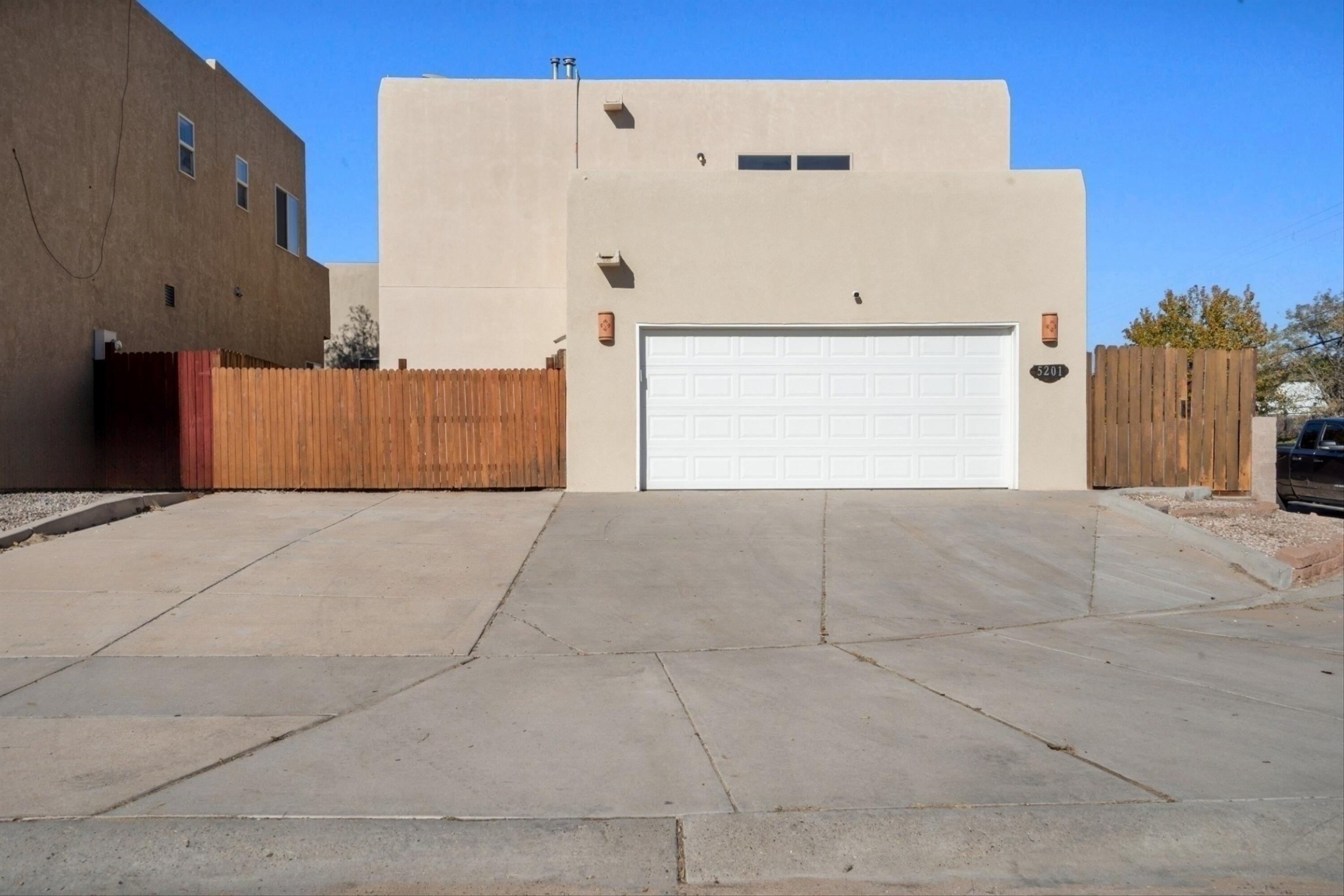 Welcome to this beautifully updated corner lot home! This move-in-ready, two-story residence boasts granite countertops, efficient LED lighting, and refrigerated air. Upstairs, you'll find three spacious bedrooms, including a master suite with a walk-in closet. The home's inviting patio, complete with classic vigas and ceramic sconces, enhances its unique character. Recent updates include a full HVAC system (April 2024), a new garage door with lift/motor (June 2024), solar panels for energy savings (January 2023), and a new roof (November 2022). An ADT alarm system with cameras offers added security. With an oversized two-car garage, a spacious laundry area, and fresh interior paint, this home is nestled in a neighborhood close to shopping, dining, and more.