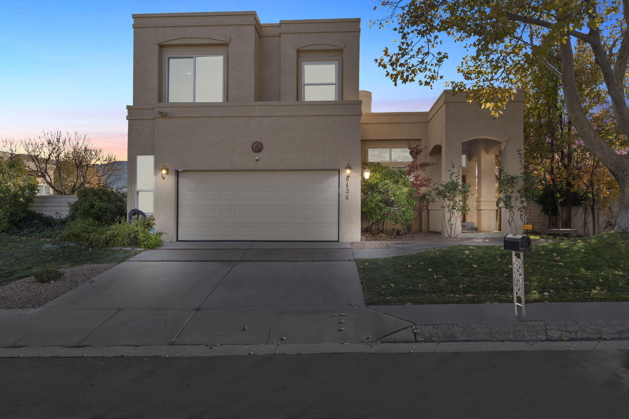 Enjoy some of the best views in Tanoan East with this exclusive offering! This rare gem has been recently remodeled with newer TPO roof (2021), A/C unit (2024), new carpet, lighting, bathrooms, fixtures and more.  The Chef's Kitchen is a dream with gas range, custom hood, gorgeous counters, and newer appliances.  Take in the breathtaking Sandia views across this golf course lot from either the beautifully landscaped backyard or upstairs balcony.  The incredible primary suite showcases an attached office space, gas fireplace, private balcony and spa-like en suite with separate soaking tub and two walk-in closets.  And there's room for everyone with the HUGE finished basement featuring a giant living space, 3/4 bath, bedroom, flex room and unbelievable storage.  Less than a one-mile walk