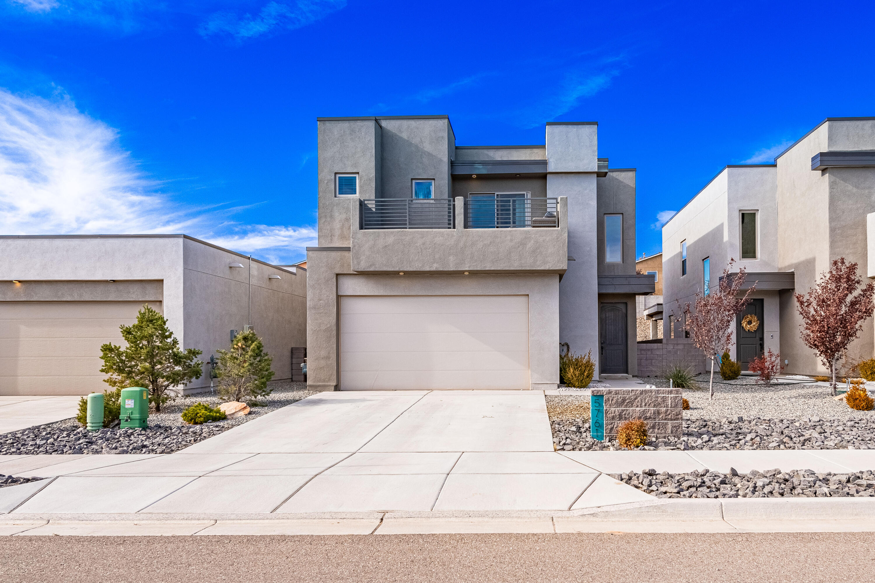 Welcome to 5761 Cosmo Ct NE in the sought-after 35 North community of Rio Rancho! Built by Abrazo, this beautiful home offers a peaceful escape from city life with stunning views and a walled backyard featuring a covered patio for ultimate relaxation. The open-concept floor plan is perfect for entertaining, while each bedroom includes a walk-in closet for plenty of storage. The spacious primary suite features a private balcony to take in the views, and the added loft offers extra versatile living space. Conveniently located near Highway 550 for easy commuting to Santa Fe, Bernalillo, or Albuquerque, this home is ready for its new owners. Don't miss out!