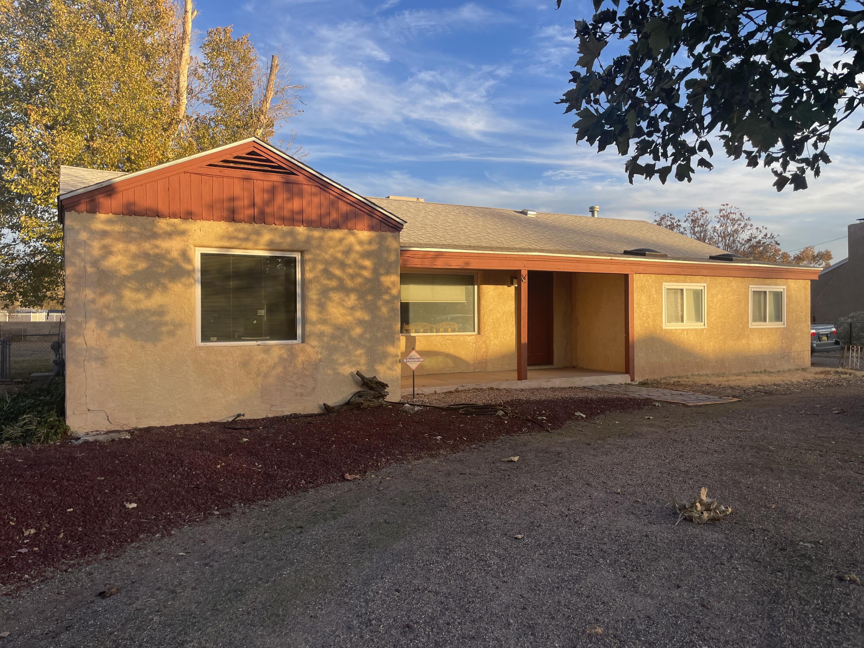 Charming Home in Los Ranchos de Albuquerque!This 3-bedroom, 2-bathroom home offers 1,881 sq. ft. of living space on a spacious 0.41-acre lot. Enjoy a two-car garage with an detached workshop and extra bathroom, perfect for projects or storage. Located in the serene Los Ranchos community, this property combines rural charm with convenient city access. Home is priced to sell AS-IS.