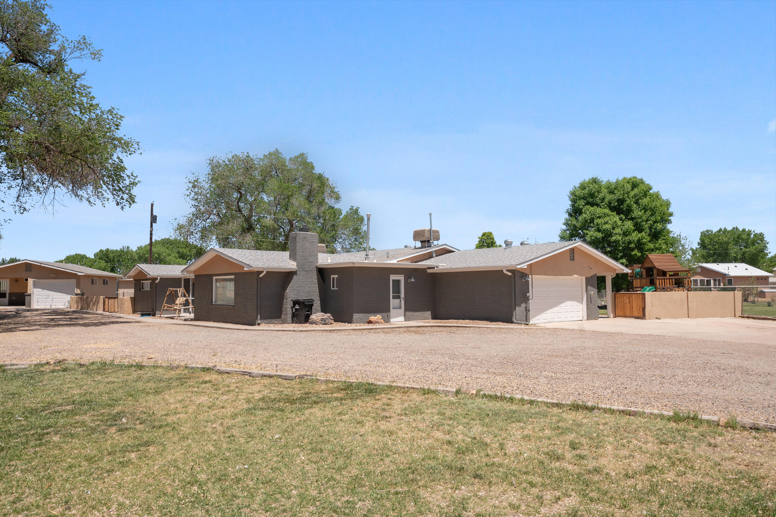 Nestled in the heart of Bosque Farms, this charming farmhouse offers an unparalleled opportunity for those seeking a serene and spacious retreat. With over 1 acre of land that has its own irrigation well this property is a haven for furry friends! The main house itself comprises two separate living spaces, providing versatility and ample room for both relaxation and entertainment. With four generously sized bedrooms, there's plenty of space for the whole family to spread out and unwind. Additionally, a cozy casita awaits, boasting its own garage and washer and dryer area, making it ideal for guests or as a potential source of additional income.Comes with a barn and fenced-off area for safety and comfort of your beloved pets, allowing them to roam and play. Make this oasis yours!