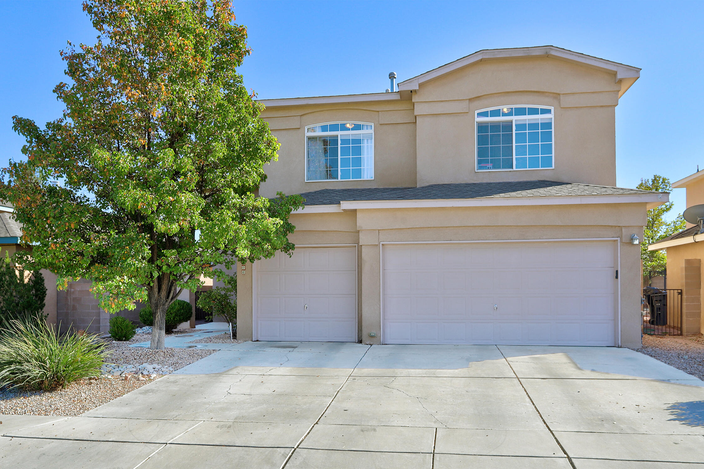 Charming 2-Story Home with Abundant Light, Open Spaces, and Beautiful Landscaping! Welcome to your dream home! This spacious two-story residence features two inviting living rooms, a cozy loft, and an open-concept kitchen that's perfect for entertaining. Bathed in natural light throughout, every room in this home feels warm and welcoming. 3 spacious bedrooms with a balcony off the primary bedroom to bask in the NM skies. The thoughtfully landscaped yard adds curb appeal and provides a peaceful outdoor retreat, ideal for relaxing or hosting gatherings. Whether you're looking for plenty of space or a place to call your own, this home has it all. Let's not forget the 3 car garage and close to the neighborhood parks and community pool!