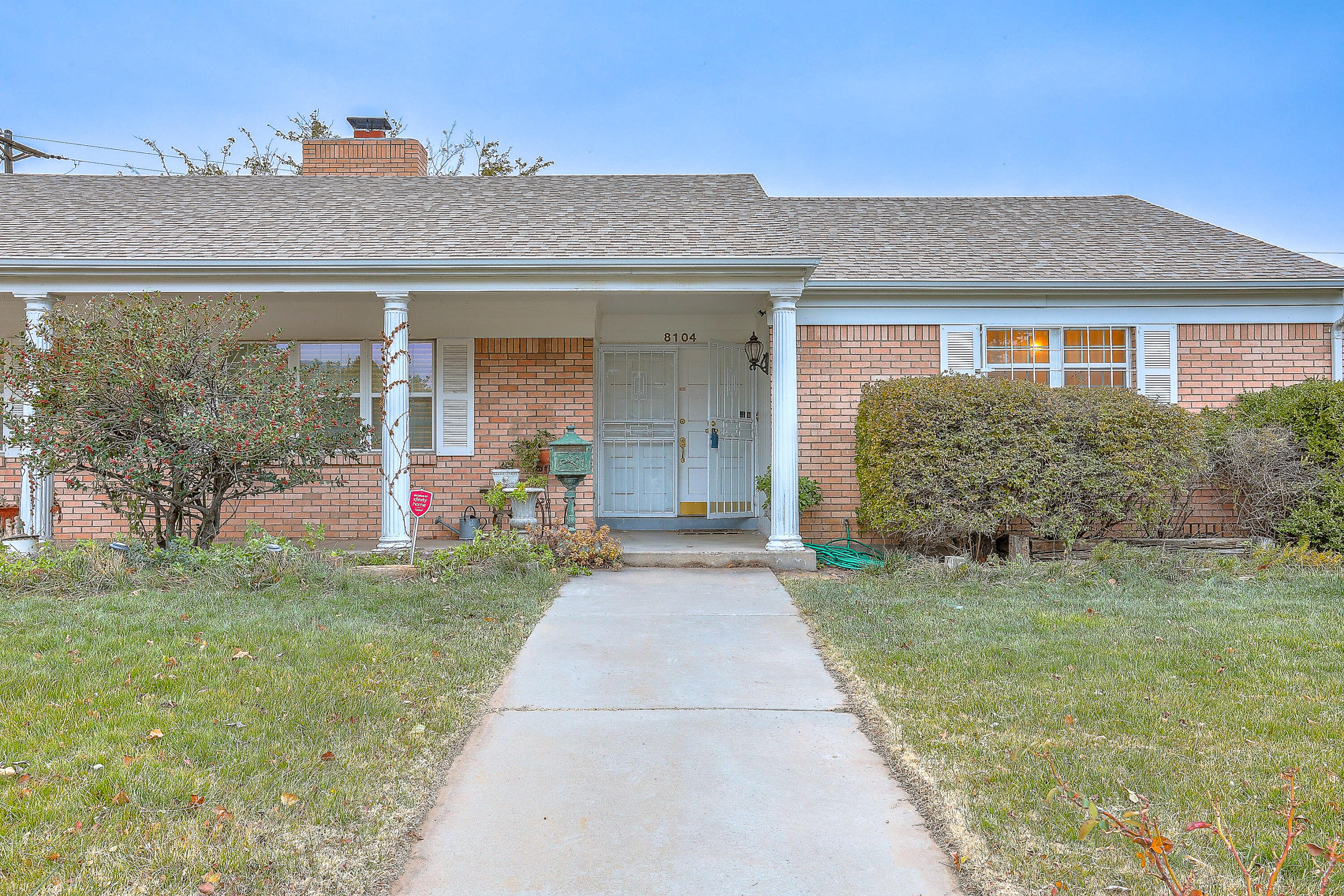 Delightful, well maintained home inside & out! The hand carved doors welcome you into the front living & dining room. Kitchen equipped with 5-burner gas cooktop, stainless appliances, granite c-tops & a roomy breakfast nook. Cozy den with gas log fireplace, built-in shelving/cabinets & sliding door looking out to the back yard oasis. Year around beauty awaits under the expansive covered patio, lush and mature landscaping + heated swimming pool. Gleaming hardwood floors in most rooms with tile in all wet areas & natural stone tile entry (no carpet). Large, inviting bedrooms with spacious closets. Bathrooms updated with granite countertops & tile surround showers. Plenty of storage & a partially floored attic with pull down stairs. A special find in a wonderful established neighborhood.