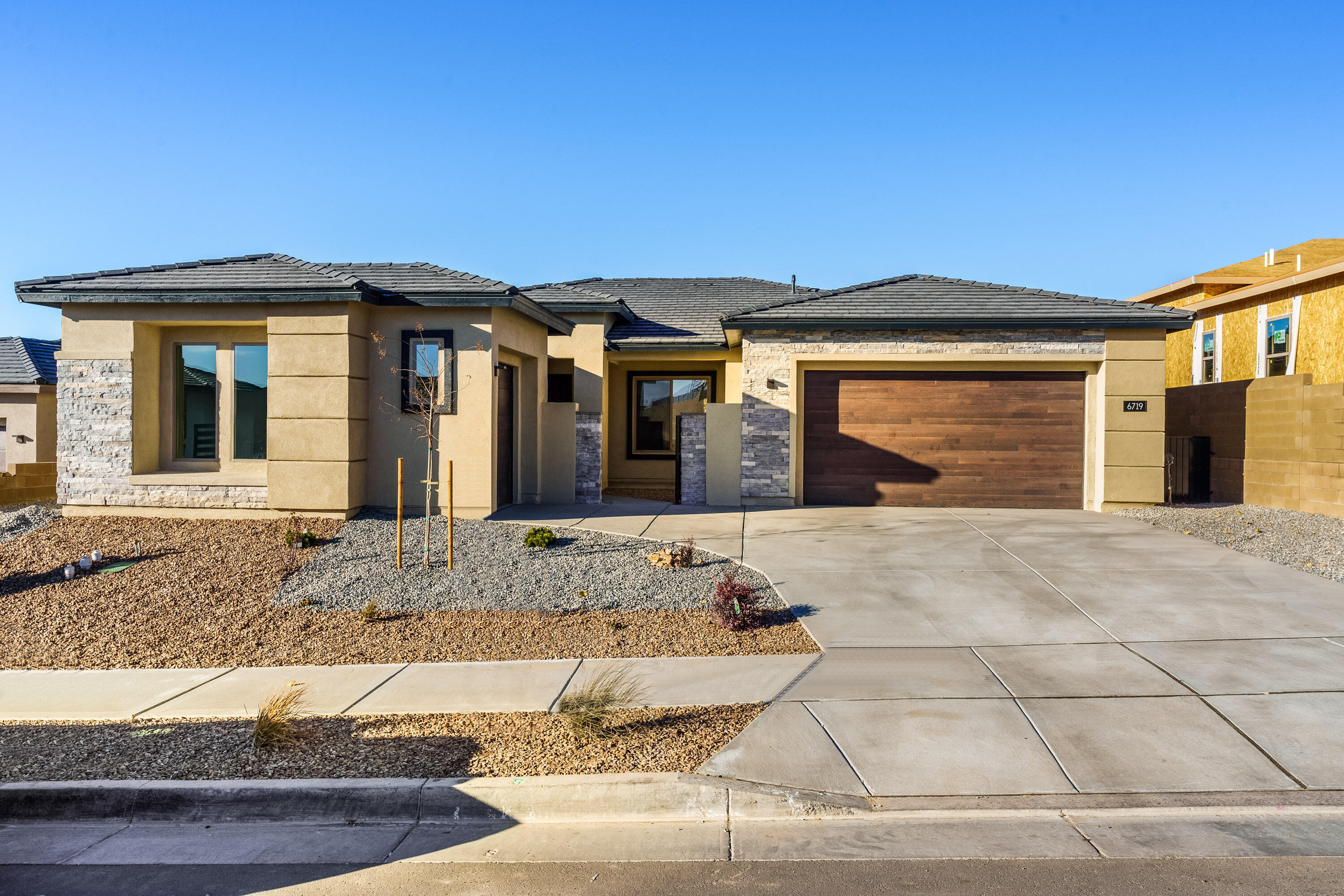 Ready now! This brand new, never-lived-in Pulte home features the Rockledge floorplan with a modern Tuscan exterior and private courtyard entry. Inside, enjoy skip trowel paint, 5-inch baseboards, and a Multi-Panel Sliding Glass Door at the Gathering Room with a corner fireplace. The kitchen boasts white maple cabinets, Breckenridge Granite countertops, and a waterfall edge island with basalt-colored cabinetry, complemented by a KitchenAid pro range appliance package. The owner's bath offers a 6-foot soaking tub, a 9-foot spa-like shower, and custom tile surrounds. A perfect blend of style and luxury!