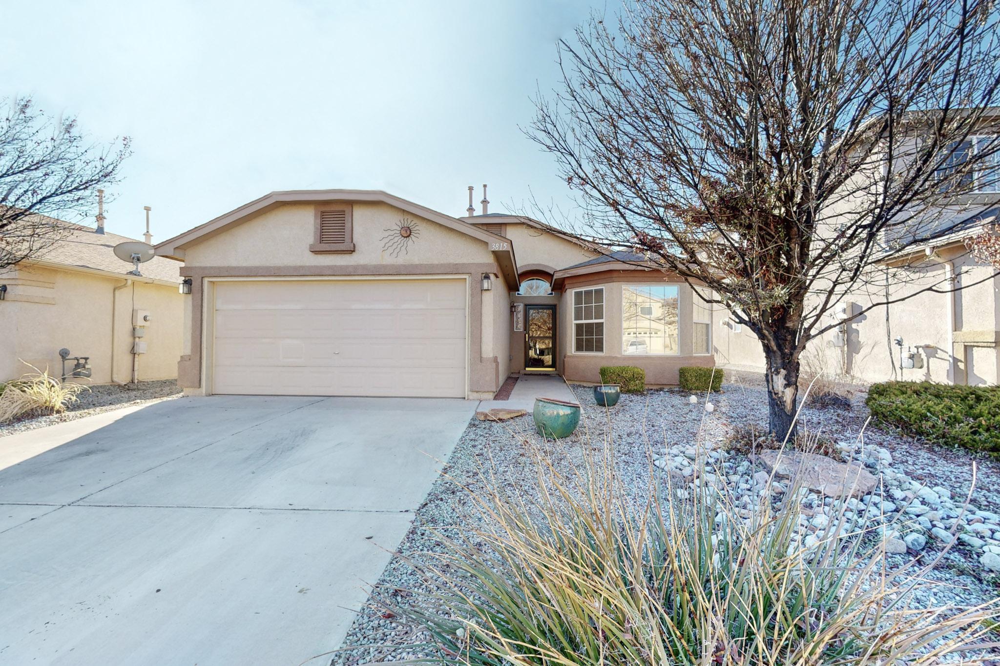 Discover this charming single-story gem in Northern Meadows! Perfect for first-time buyers or anyone seeking a beautifully designed, low-maintenance home. The open floor plan features a spacious great room with a cozy gas fireplace, soaring cathedral ceilings, and tasteful tile throughout. The gourmet kitchen boasts Corian countertops, a pantry, and sleek black appliances, flowing seamlessly into the great room for effortless entertaining. The oversized primary suite offers a private retreat with a double vanity, garden tub, separate shower, and walk-in closet. Conveniently located near schools, the Rio Rancho Event Center, and Sandoval County Medical Center, this home is a true standout!