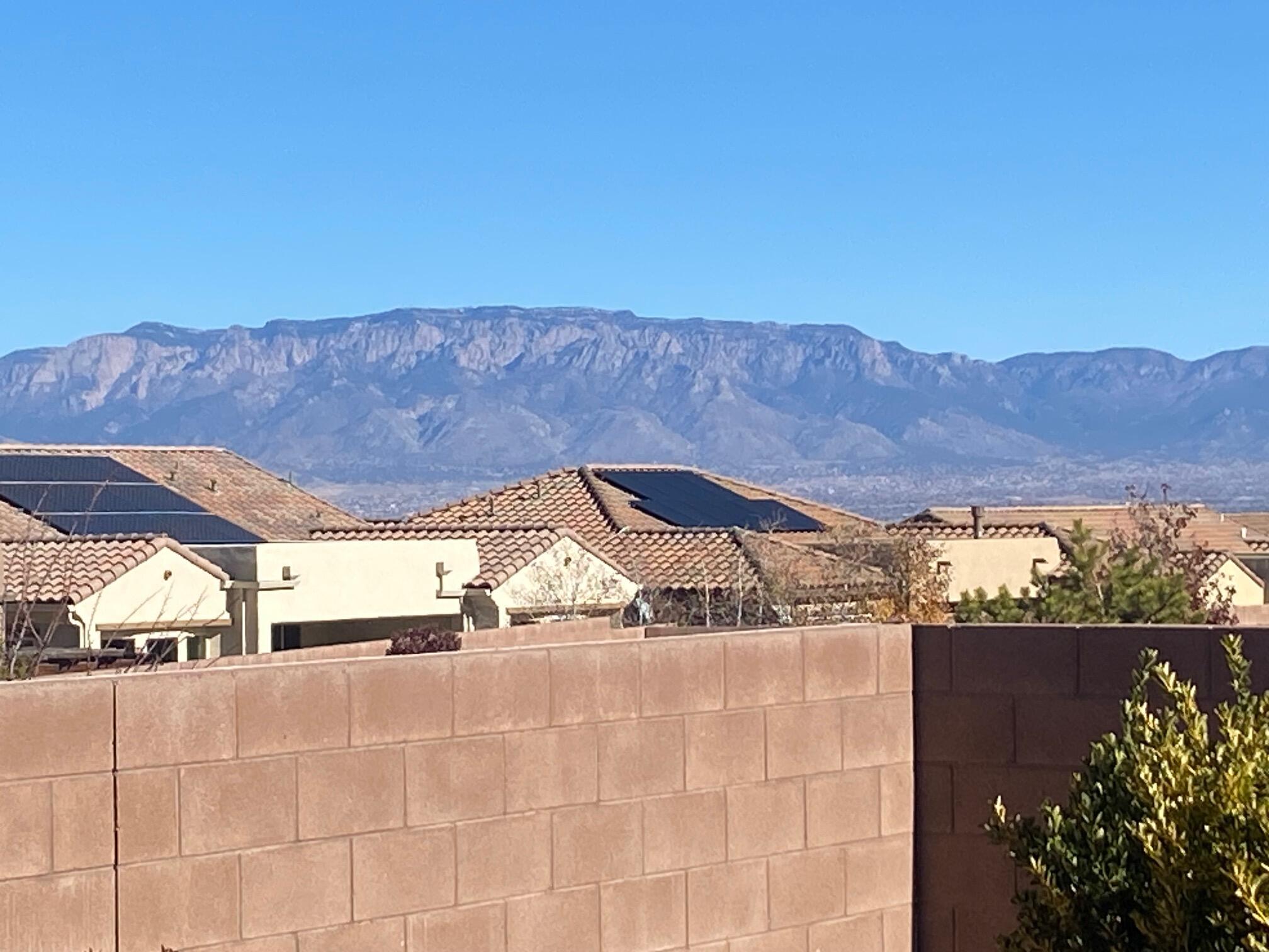 Del Webb 55+ Community!  One story home with a forever Mountain View!! This popular Sanctuary Floorplan has1942SF, 2 BR's Plus an Office/Den or Third BR!! $10,000 CREDIT TOWARD GRANITE FOR COUNTERTOPS & ISLAND w/Acceptable Offer!  Professionally cleaned & move in ready for a quick closing!!! Kitchen has plenty of cabinetry!  All Appliances Stay! Custom Iron Security Door! Brand new Synthetic Stucco Paint (Nov 24)! New Carpeting in both bedrooms & Closets (Dec 24)!  Built-in Gas Fireplace on the back patio!  Plantation Shutters throughout! Ceiling Fans! Insulated garage door! The courtyard has nice pavers & gate.  Prof landscaped front & back. You'll love the views from the living Room, dining room & back patio! Enjoy the Sandia Amenity Center!! Pickle Ball & Tennis Courts & so much more!