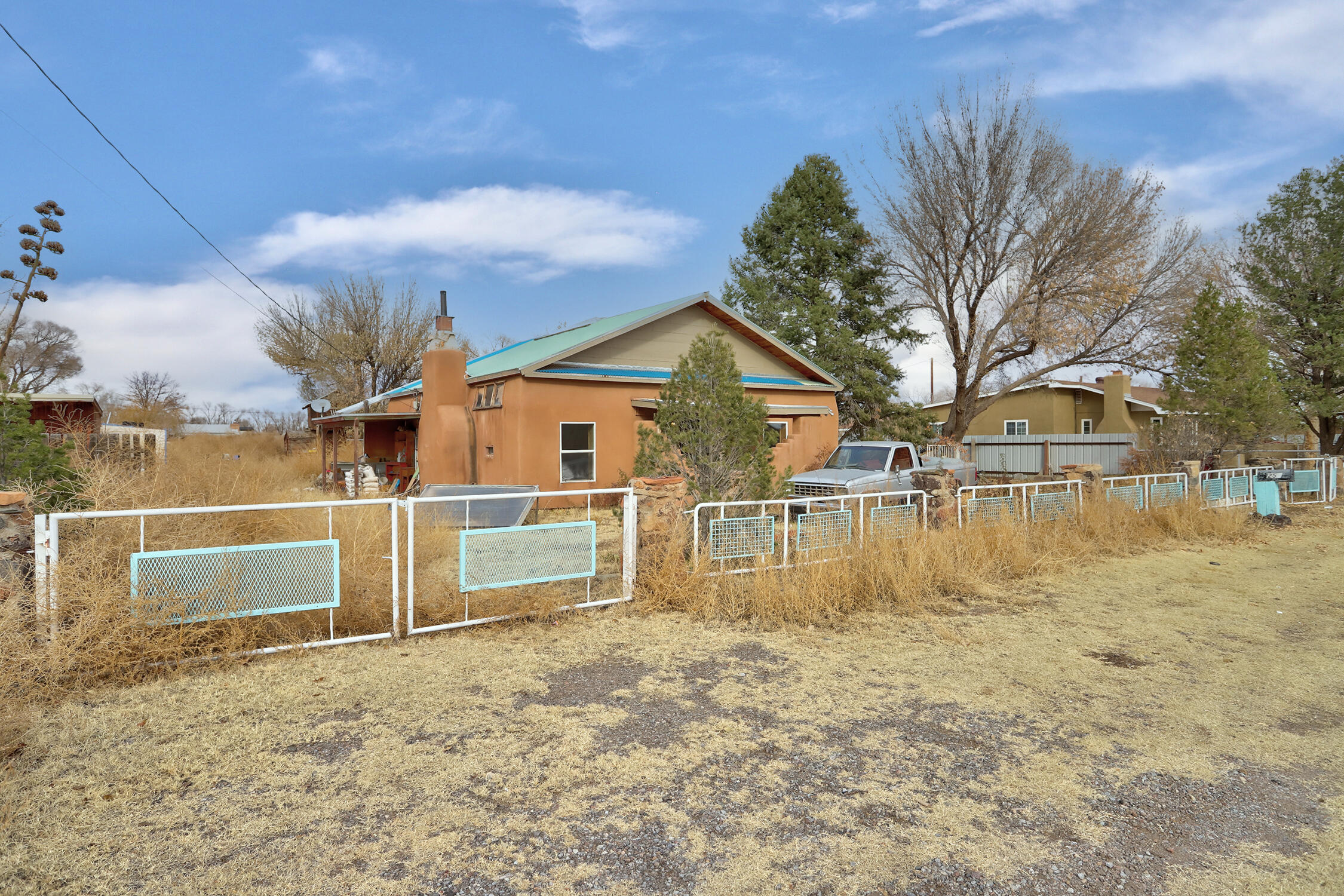 Fixer-Upper Opportunity in Highly Sought-After Bosque Farms! This property offers 0.58 acres of potential and is ideal for buyers with a vision. The property includes a charming adobe home that needs renovation and a detached garage/workshop. Located in a desirable neighborhood, this home offers a great balance of rural living while still being close to essential amenities. Sold As-Is, this is an excellent opportunity for investors or those looking to put in some work to create their dream home!