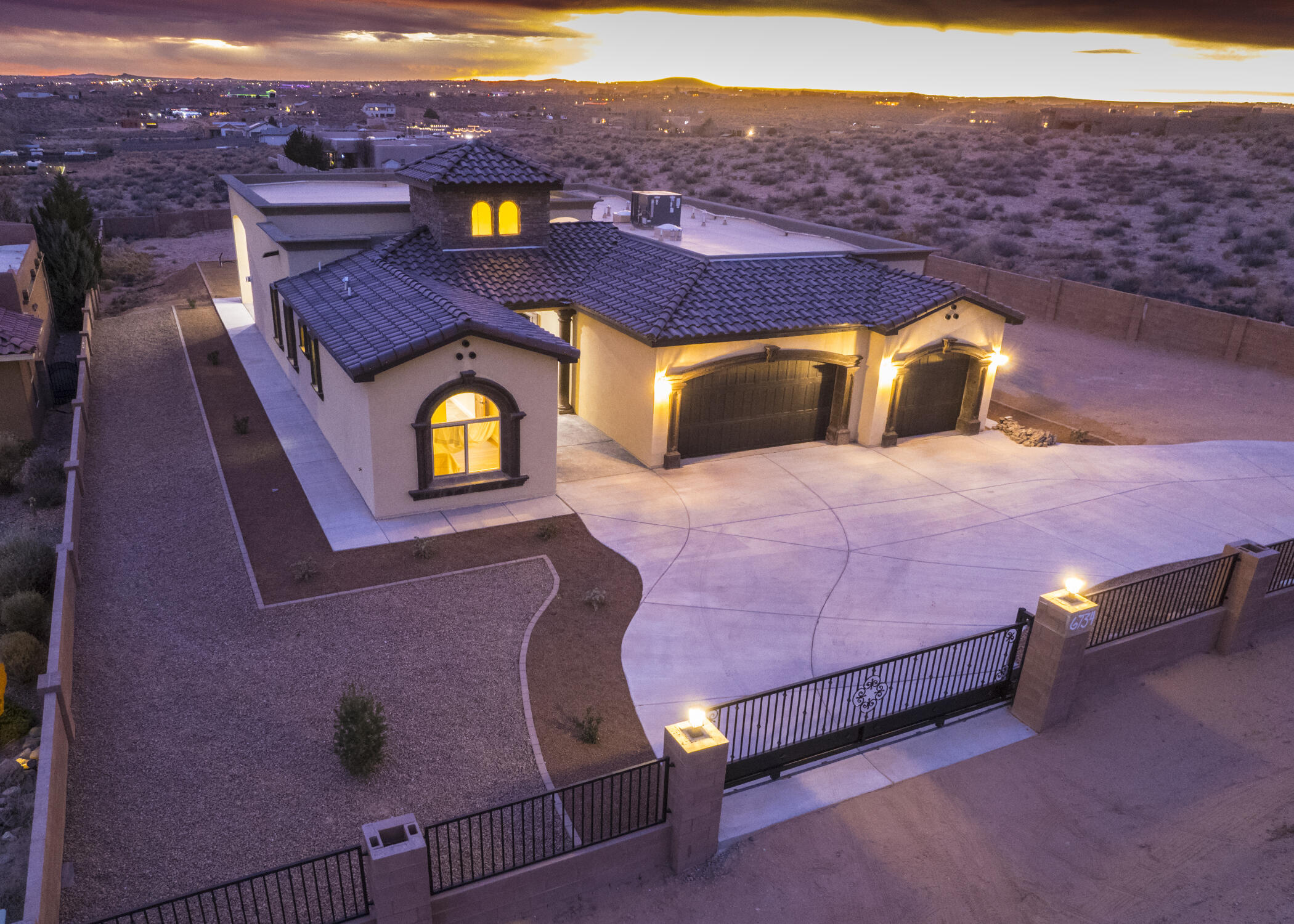 Absolutely Stunning HOME! Luxurious New Built Custom Home in Rio Rancho Estates on Large View Lot, surrounded by Block Wall Fencing & Remote Gate for Ultimate Privacy and Tranquility. Enter through the Custom Cantera Double Door, Cascading on the Italian Marble Flooring, leading to the Massive Great Room w/Gas Fireplace, Dining Area & 4-Panel Arcadia Door overlooking the City Views & Night Lights! Gourmet Kitchen is enriched by Quartz Counters, Commercial Stainless Steel Stove & Appliances, Dark Wood Cabinetry w/Crown Molding. Master Suite has Large Walk-in Shower, His & Her Cabinets & 12' x 12' Classy Closet. Step into the Sprawling Entertaining Backyard, w/Large Covered Patio, RV Gate, 3 Car Oversized Garage & Spectacular Views.