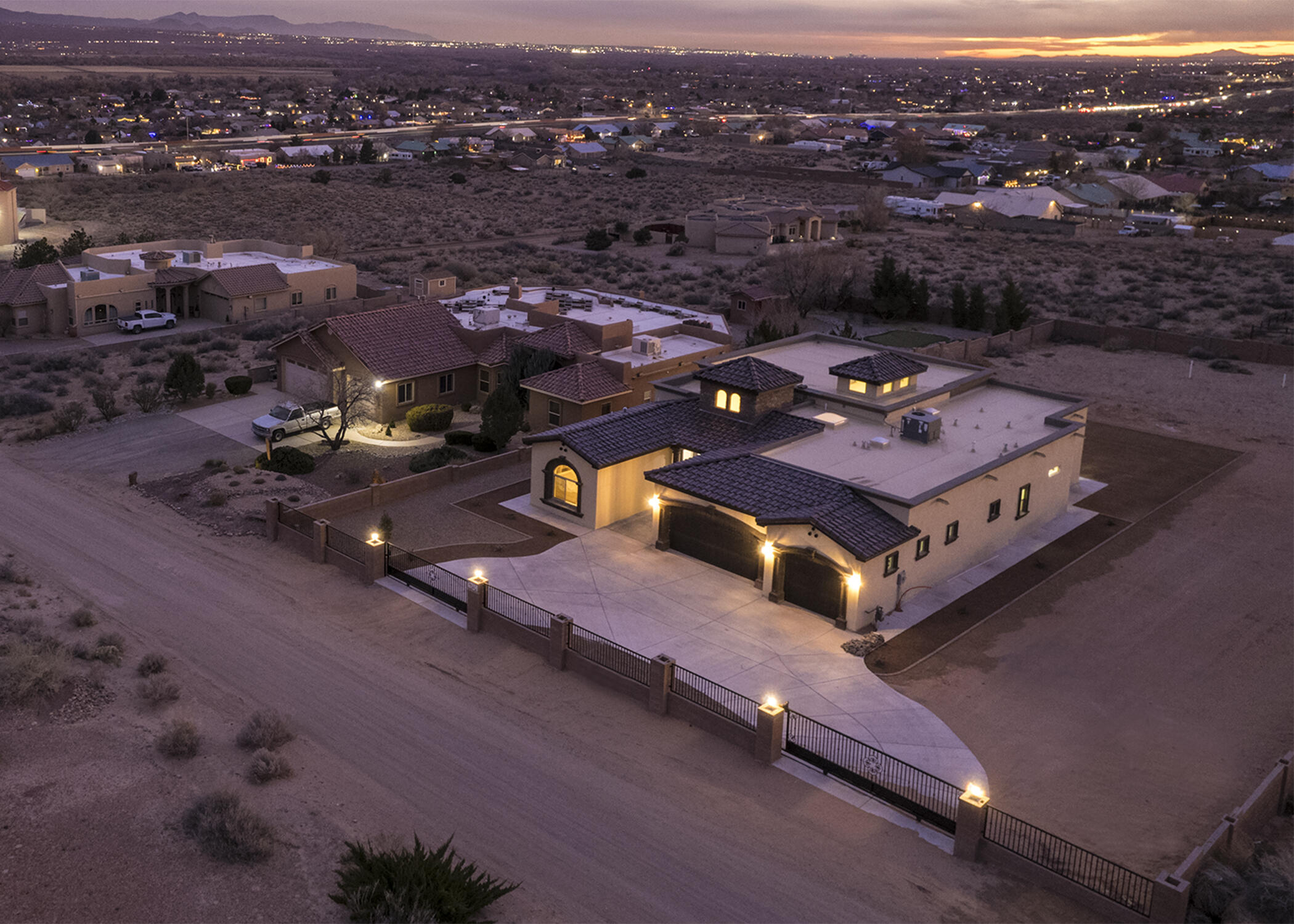 Absolutely Stunning HOME! Luxurious New Built Custom Home in Rio Rancho Estates on Large View Lot, surrounded by Block Wall Fencing & Remote Gate for Ultimate Privacy and Tranquility. Enter through the Custom Cantera Double Door, Cascading on the Italian Marble Flooring, leading to the Massive Great Room w/Gas Fireplace, Dining Area & 4-Panel Arcadia Door overlooking the City Views & Night Lights! Gourmet Kitchen is enriched by Quartz Counters, Commercial Stainless Steel Stove & Appliances, Dark Wood Cabinetry w/Crown Molding. Master Suite has Large Walk-in Shower, His & Her Cabinets & 12' x 12' Classy Closet. Step into the Sprawling Entertaining Backyard, w/Large Covered Patio, RV Gate, 3 Car Oversized Garage & Spectacular Views.