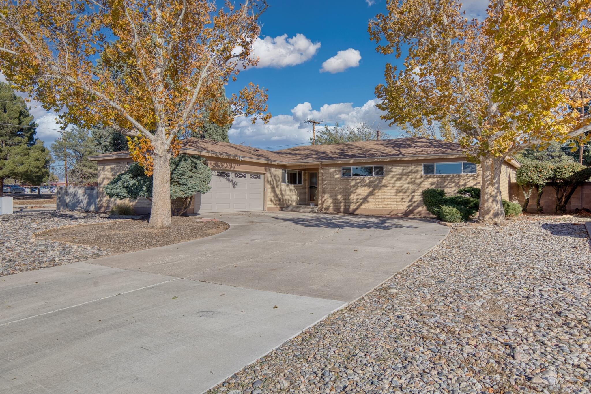 Welcome to this charming mid-century modern home in the heart of Albuquerque! Built in 1957, this unique property boasts 4 spacious bedrooms, 2.5 bathrooms, and a generous square footage of 1851. Situated on a sizable lot of .25 acres, this single-story home offers ample space for entertaining and relaxation. Step inside and be greeted by the warm and inviting living room, complete with a cozy fireplace and large windows that flood the space with natural light. The kitchen features sleek countertops, stainless steel appliances, and plenty of storage space for all your culinary needs. The master bedroom is a true retreat, with an en-suite bathroom. Three additional bedrooms provide plenty of space for guests or a home office. Schedule a showing today and make this house your new home!