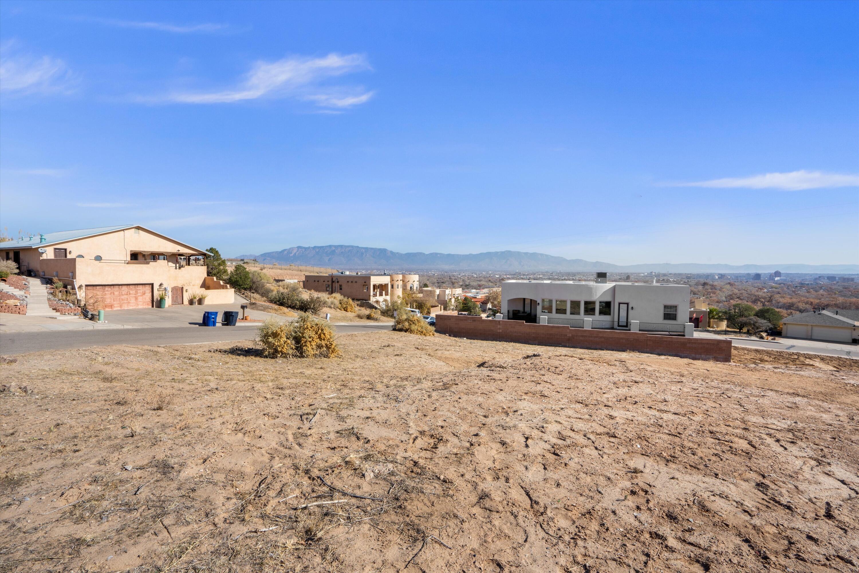 OWNER FINANCING AVAILIBLE-Discover the perfect canvas for your dream home in the highly desirable Vista Magnifica neighborhood of Albuquerque. This spacious corner lot offers endless possibilities with its ideal location and stunning views of the Sandia Mountains.