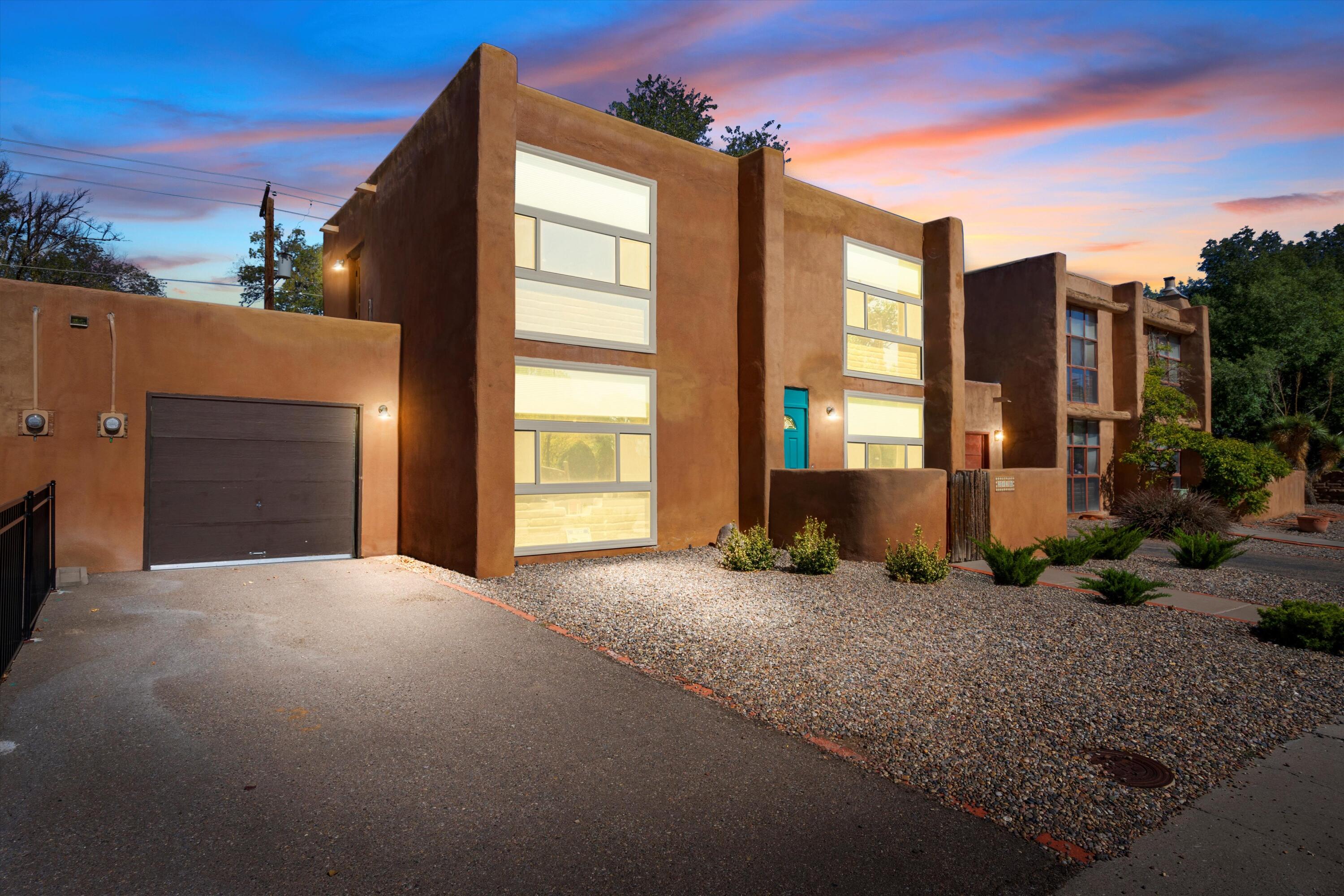 DISCOVER YOUR TRANQUIL RETREAT IN THE HEART OF NORTH VALLEY! This beautifully crafted 2-bedroom, 2-bath townhouse is where Southwestern charm meets modern comfort. Step through the door and feel the embrace of a traditional kiva fireplace and rustic wooden beams, setting the stage for cozy evenings or vibrant gatherings. With fully modern bathrooms and a sleek kitchen, style and function come together effortlessly. Natural light floods through  front windows, illuminating each thoughtfully designed space. Each bedroom serves as a private oasis with its own ensuite bath for ultimate privacy. Located in a gated community, the HOA covers your water bill and takes care of lush common areas, so you can focus on enjoying your sanctuary. Star true Southwestern living today! Call now!