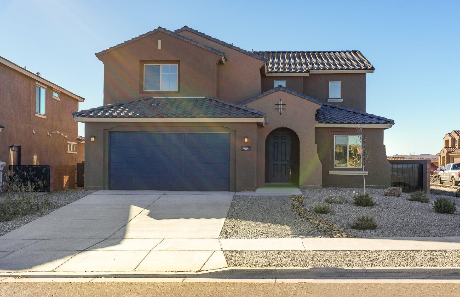 Ready Now! Yucca home is located in one of Rio Rancho's highly sought after Communites! Enjoythe popular Yucca home that boast natural lighting throughout with oversized windows along with the center sliding glass door. You will be amazed at the high cathedral ceiling at the gathering room!  Guest suite at main level will have their own lprivate bath. The primary suite is located on the main level. You will enjoy cooking  in the upgraded chefs kitchen . The kitchen will include built in gas cook top along with Stainless steel  oven/microwave.   Mark this home as a must see!