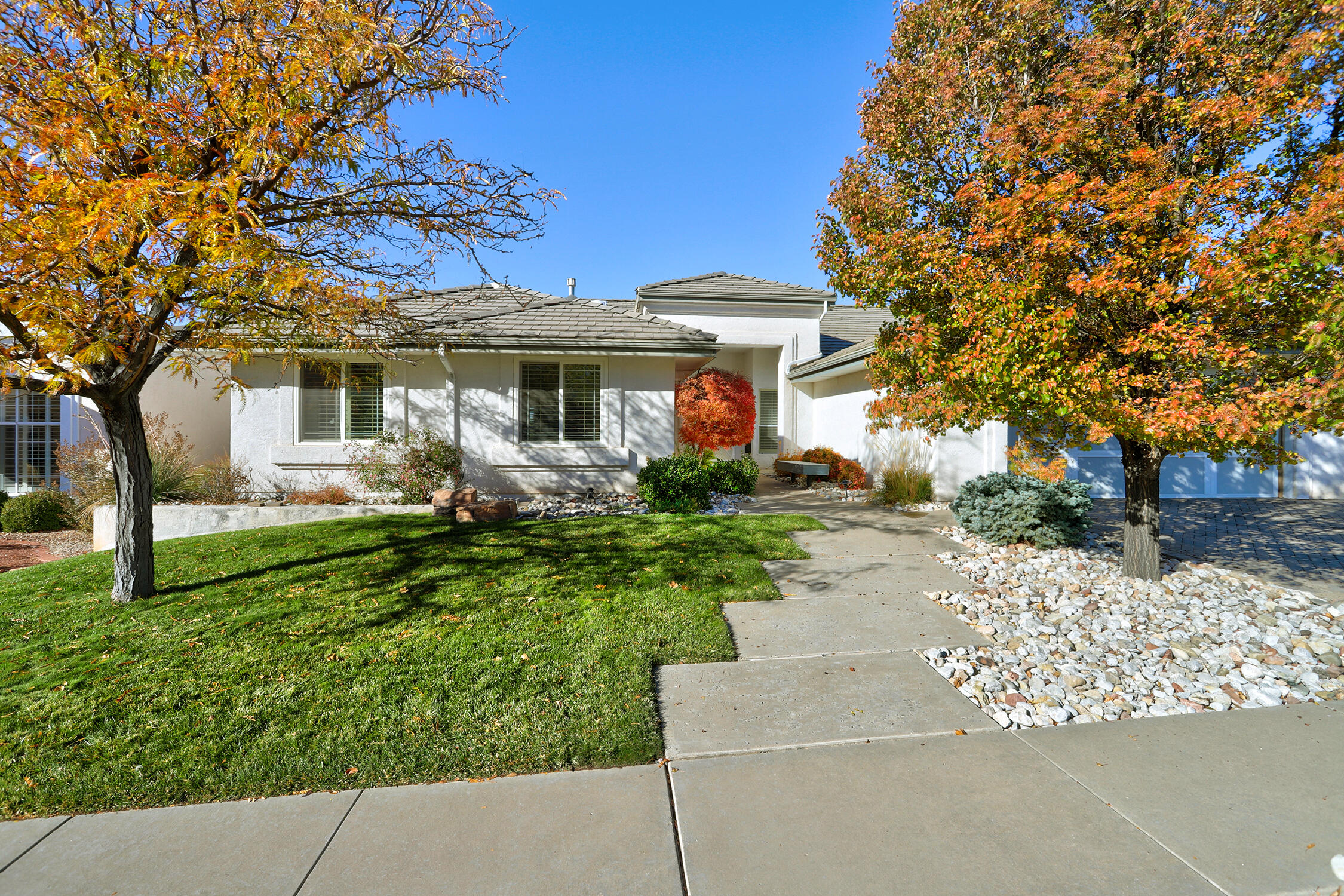 This gorgeous Peppertree home has everything you've been looking for: the main level has four bedrooms and two and a half baths; a formal area with cathedral ceilings and bar for entertaining; comfortable family room off the eat in kitchen; and an incredible outdoor living area with built in grill and fireplace, sun deck and pool access. The downstairs has its own living area, bedroom and bath that would be perfect for long term guests or multi-generational living, and a sun or workout room with direct access to the pool deck. With hickory hardwood floors, wood shutters, granite counters and stainless appliances, a walk in closet in primary suite which also features dual sinks, snail shower and soaking tub. This home is a perfect combination of fun and beautiful luxury.