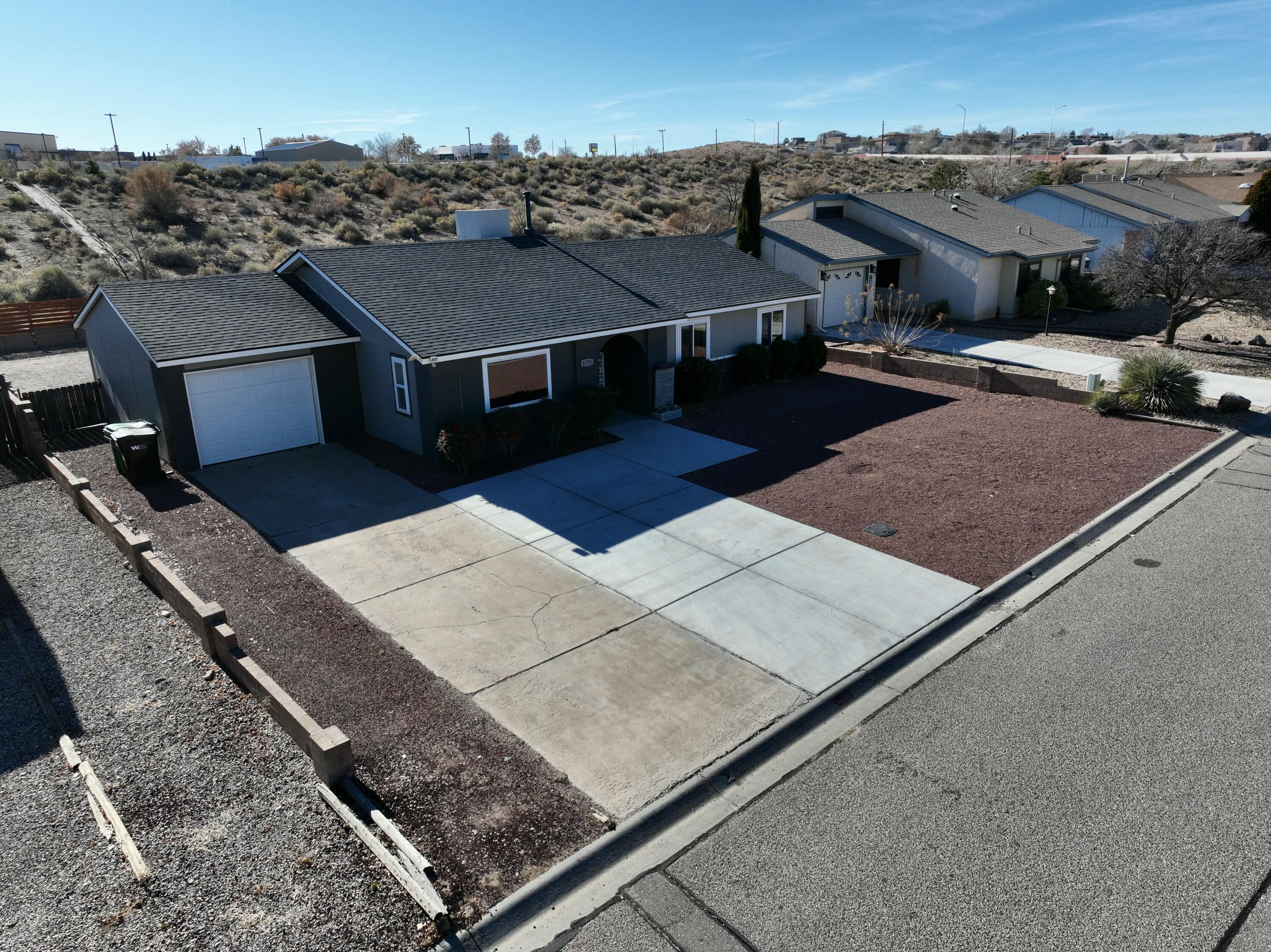 Located in the sought-after Rivers Edge community of Rio Rancho, this charming 3-bedroom, 2-bath home offers warmth and style. The cozy primary bedroom provides a tranquil retreat, while the unique 70s-style sunken living room adds character and charm, perfect for relaxing or entertaining. The spacious backyard is a standout feature, offering endless opportunities for gatherings, gardening, or enjoying the New Mexico sunshine. Blending vintage appeal with modern comfort, this home is ideal for those seeking charm and functionality in a vibrant neighborhood.