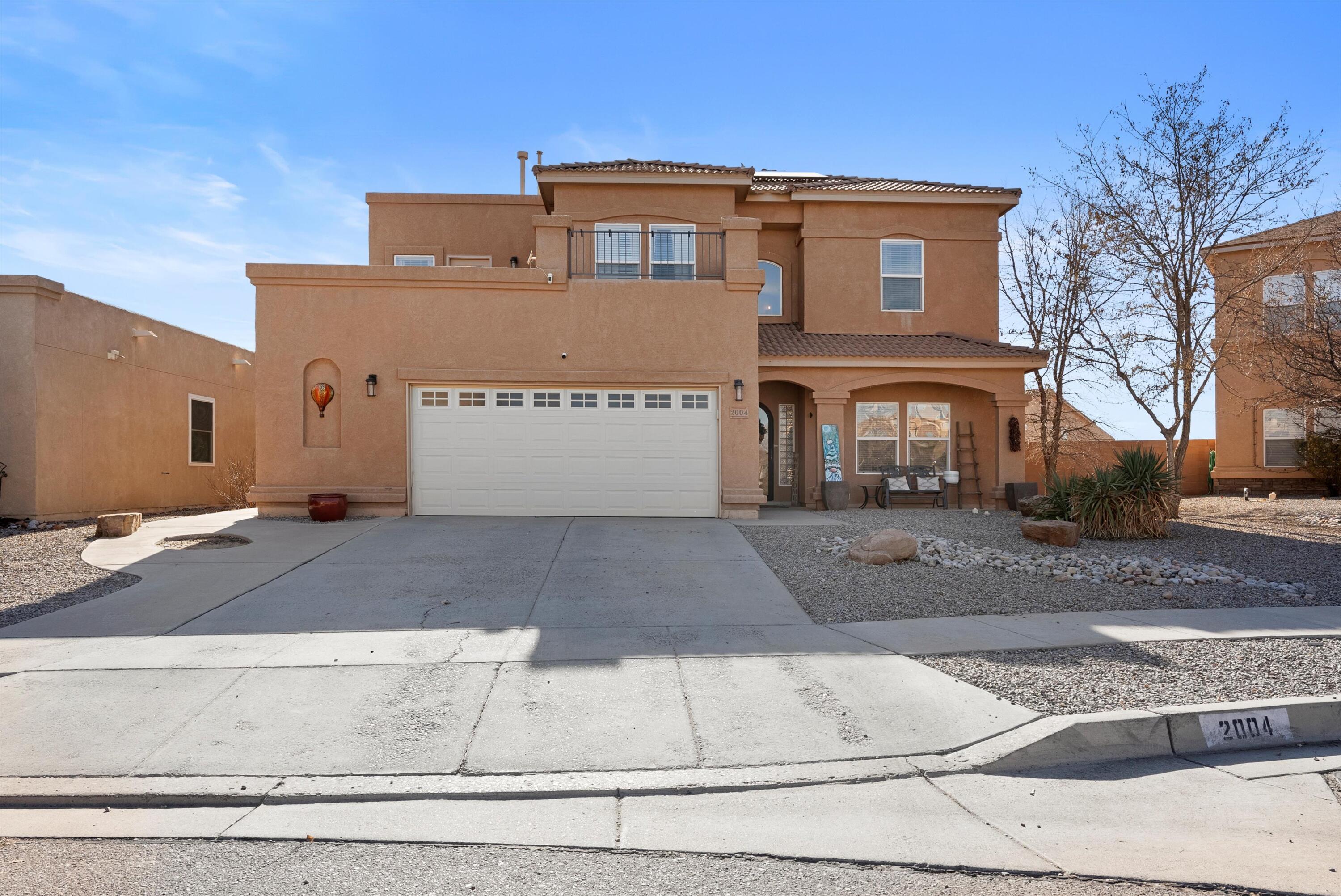 Welcome Home to this exceptional Cabazon home with an open floor plan & high warm wood ceilings with vigas. Very spacious 4 bedroom, 3 full bath home with a bedroom and full bath downstairs. Loft upstairs offers great space for relaxing & entertaining! The home offers 2 living areas--one on the main floor & one upstairs. New carpet installed throughout! Two dining areas or flex space. The options are endless! The kitchen boasts Corian countertops, double ovens, gas cooktop, & an island with ample space. The living area is enhanced by a stone accent around the fireplace & breakfast bar. Step outside to a manicured backyard with a covered patio & turf for easy care. Love to have low electric bills? Home has solar package! Schedule your showing today as this beautiful home will not last long!