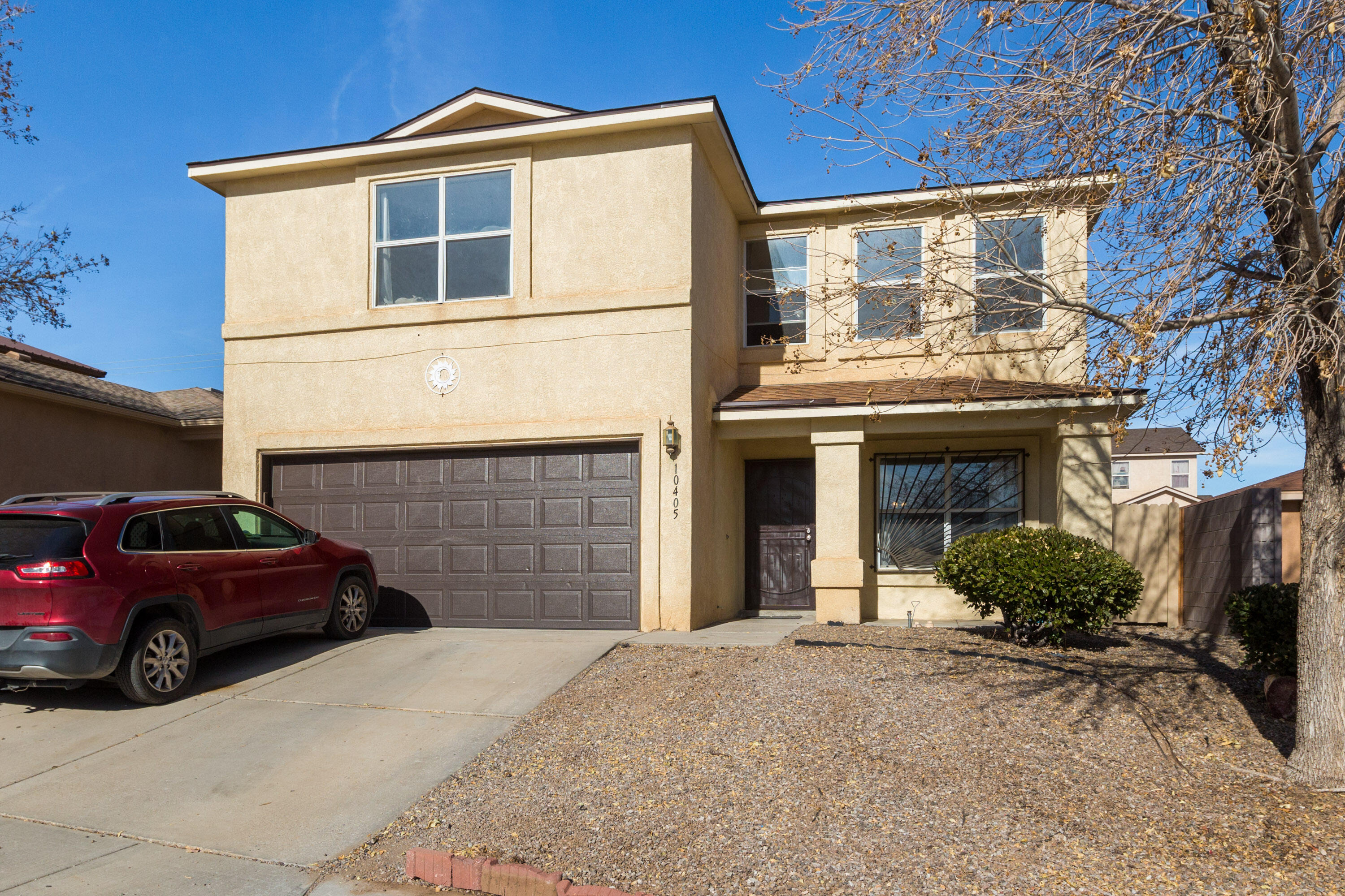 Roomy, bright Centex home in Timarron West with wood laminate floors throughout, a large living room that opens into the dining room and kitchen for an open, roomy feel and three oversize bedrooms plus a huge 14 x 19 primary suite with walk-in closet and double sink bath.   The conveniently arranged kitchen has plenty of counter space and a handy breakfast bar. A welcoming gas log fireplace in the living room will keep you warm in winter and the refrigerated air will keep you cool on those hot summer days. Outside, your choice; relax in the above-ground swimming pool or unwind in the enclosed spa. Backyard also features a 10 x 10 storage unit that can also be a studio. Roof replaced May 2024 with ten-year warranty, spa & pool in working condition and recently serviced with new pumps