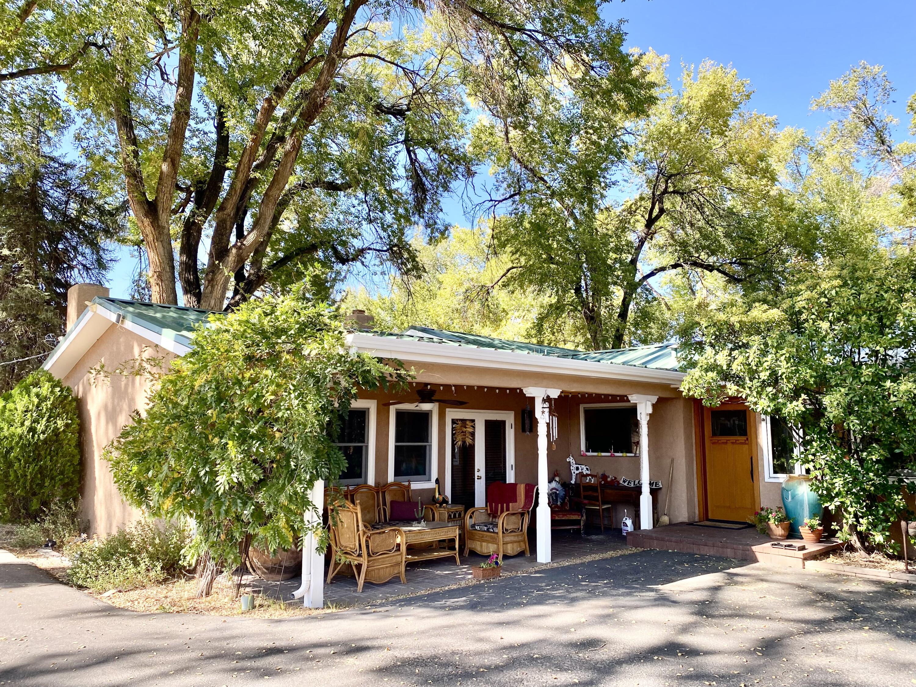 Live the life of Los Ranchos! 4.24-acre property, with two easements in place, this expansive lot offers the potential for two separate parcels, including over 3.5 acres of land in the back. The front home is situated on a 0.66-acre lot. Southwestern style residence features 2,840 sq ft of inviting space with separate beautifully appointed primary bedroom, inviting great room with wet bar and custom fireplaces. This home and lot are the essence of suburban living in the heart of the city. So many possibilities, bring your dream! For equestrian enthusiasts, the property includes exceptional facilities: a 80x150-foot horse arena, accommodations for up to 54 horses, foaling stalls, a round pen, three wells, fly spray systems, fenced paddocks, and a hot walker.