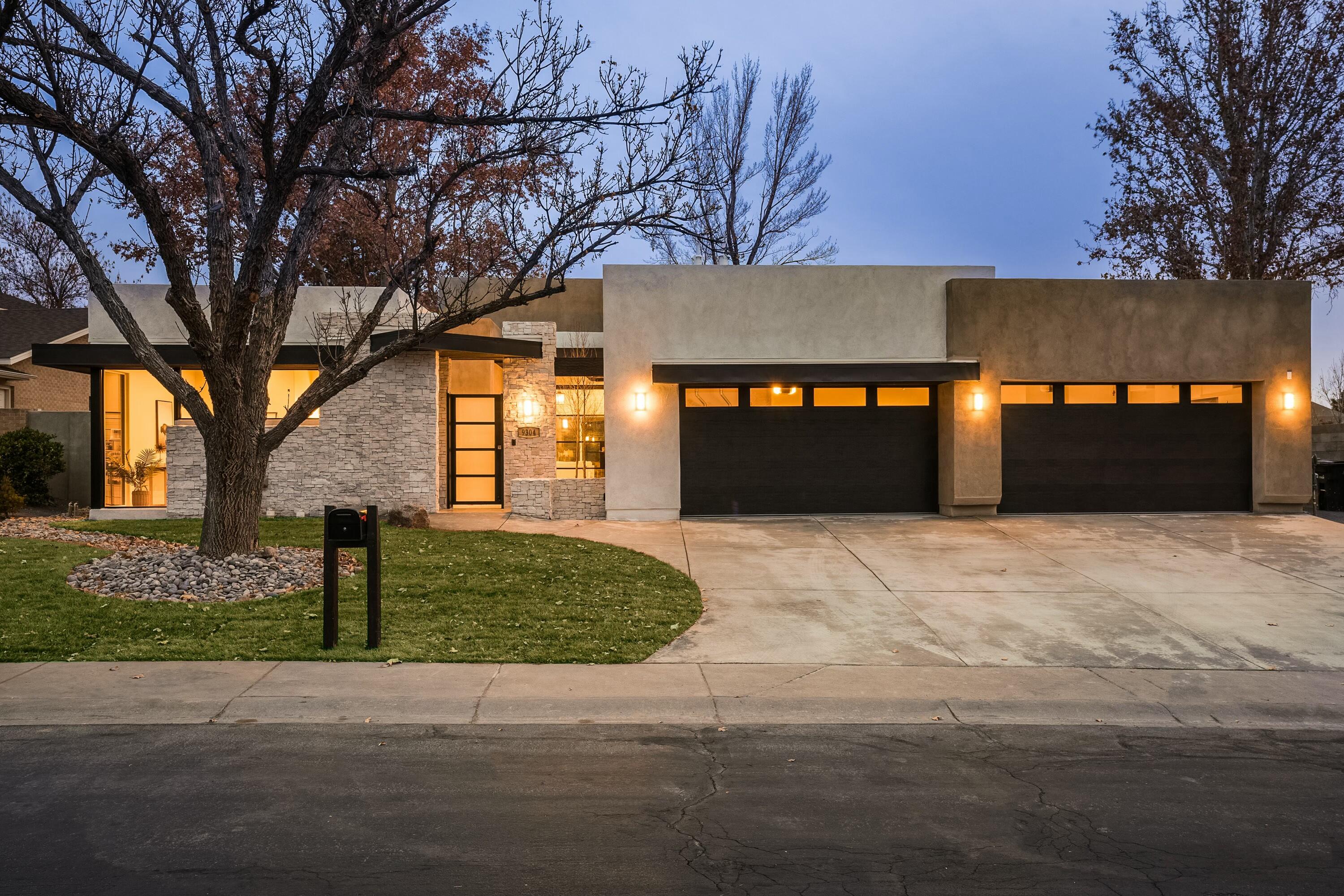 Incredible opportunity to buy new construction in Tanoan, Albuquerque's only 24/7 guard gated golf course and country club community. This Desert Modern home was built by award wining and esteemed Koinonia Architects and Builders. Enjoy a bright and open single story floor plan with incredible indoor/outdoor living including 8 sets of sliding glass doors opening to covered patios. This transitional style features clean and modern lines warmed up with natural stone, beautiful wood beams, iron light fixtures, knotty alder interior doors, a glass and steel pivoting front door, hand chiseled stone flooring, and beautiful cabinetry. Each bedroom has its own en-suite bathroom. A home theater and exercise room complete this incredible floor plan. There is also an oversized 4 car garage!