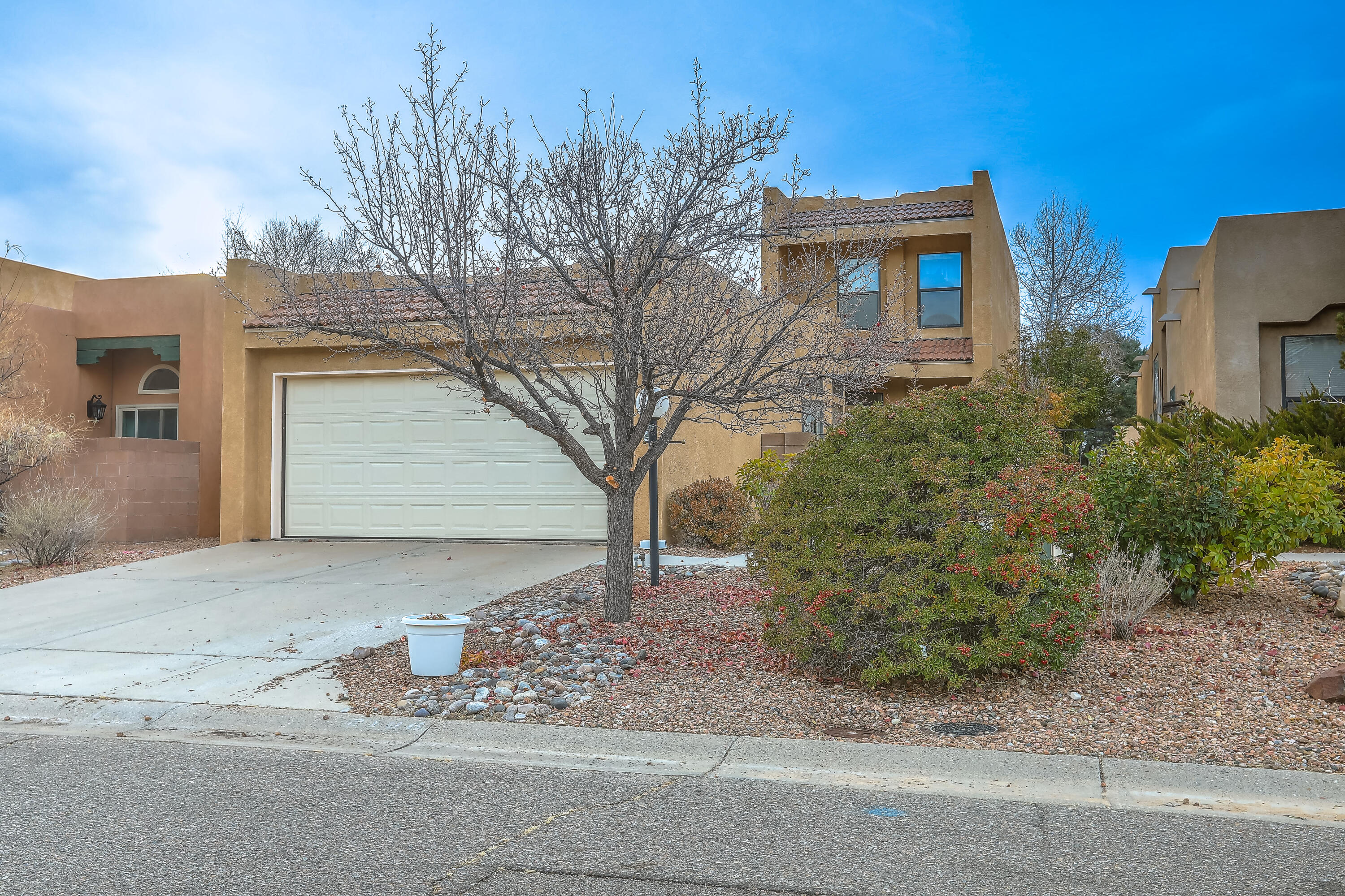 This charming NE Heights home boasts a seamless flow between the living and dining areas, complemented by a cozy breakfast nook for casual meals. The ground-floor primary suite offers convenience and privacy, while two additional bedrooms upstairs provide space for family or guests. With its thoughtful layout and inviting atmosphere, this home is perfect for entertaining or relaxing. Conveniently located near shopping, dining, it's must-see. Schedule your private showing today!