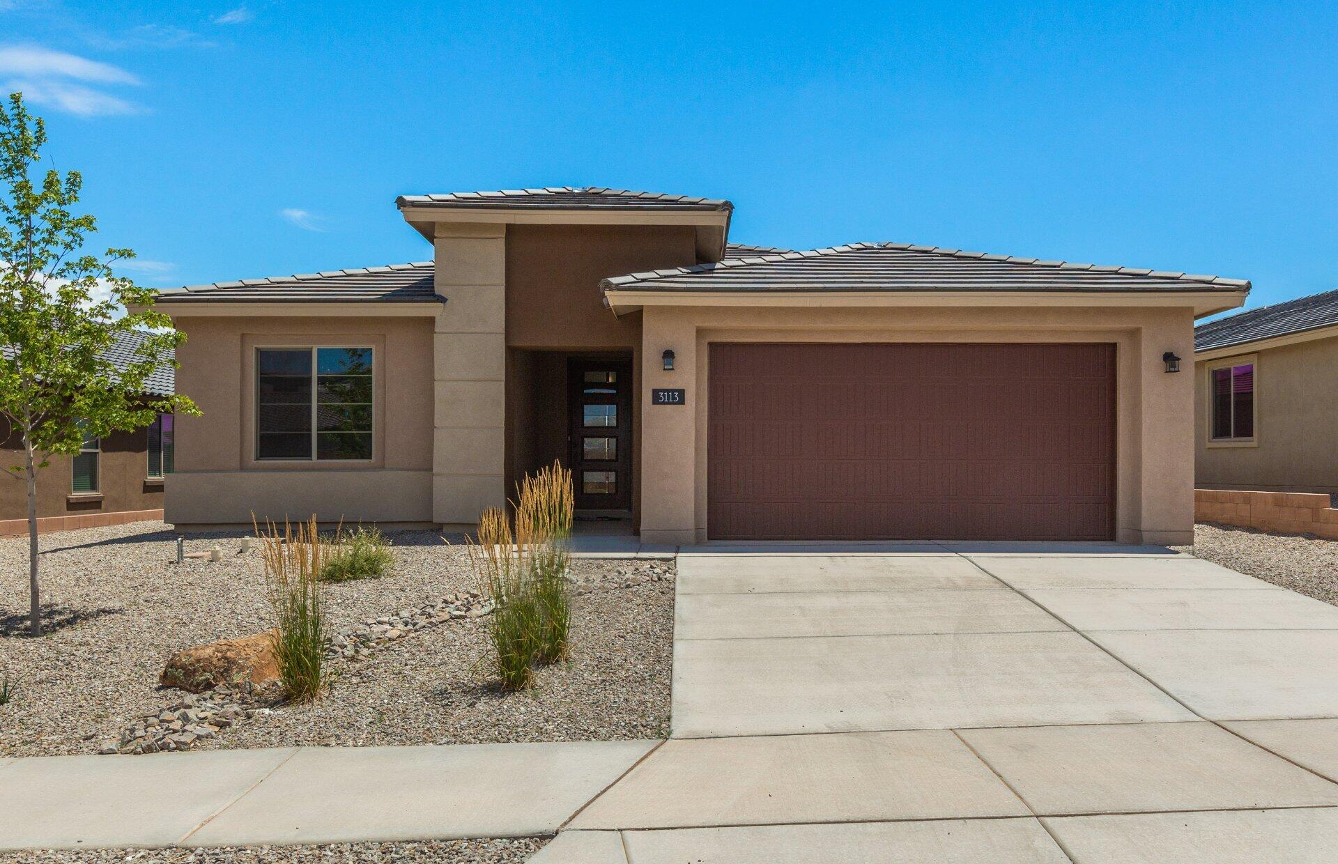 Ready Now! The elegant Gateway home is located in the highly sought-after Broadmoor Heights Estates community in Rio Rancho. This charming neighborhood features a 3-acre park, walking and biking trails, a basketball court, playground equipment, and is in Rio Rancho's top school district. This stunning single-story home boasts KitchenAid appliances, Birch Sarsaparilla cabinet stain, and Miami Vena Quartz countertops. A large kitchen island provides plenty of space for entertaining. Modern 12x24 tile flooring spans all areas except the bedrooms, which are fitted with plush carpet and 1/2'' 8lb padding for extra comfort. With its modern front exterior, this home offers beautiful curb appeal!