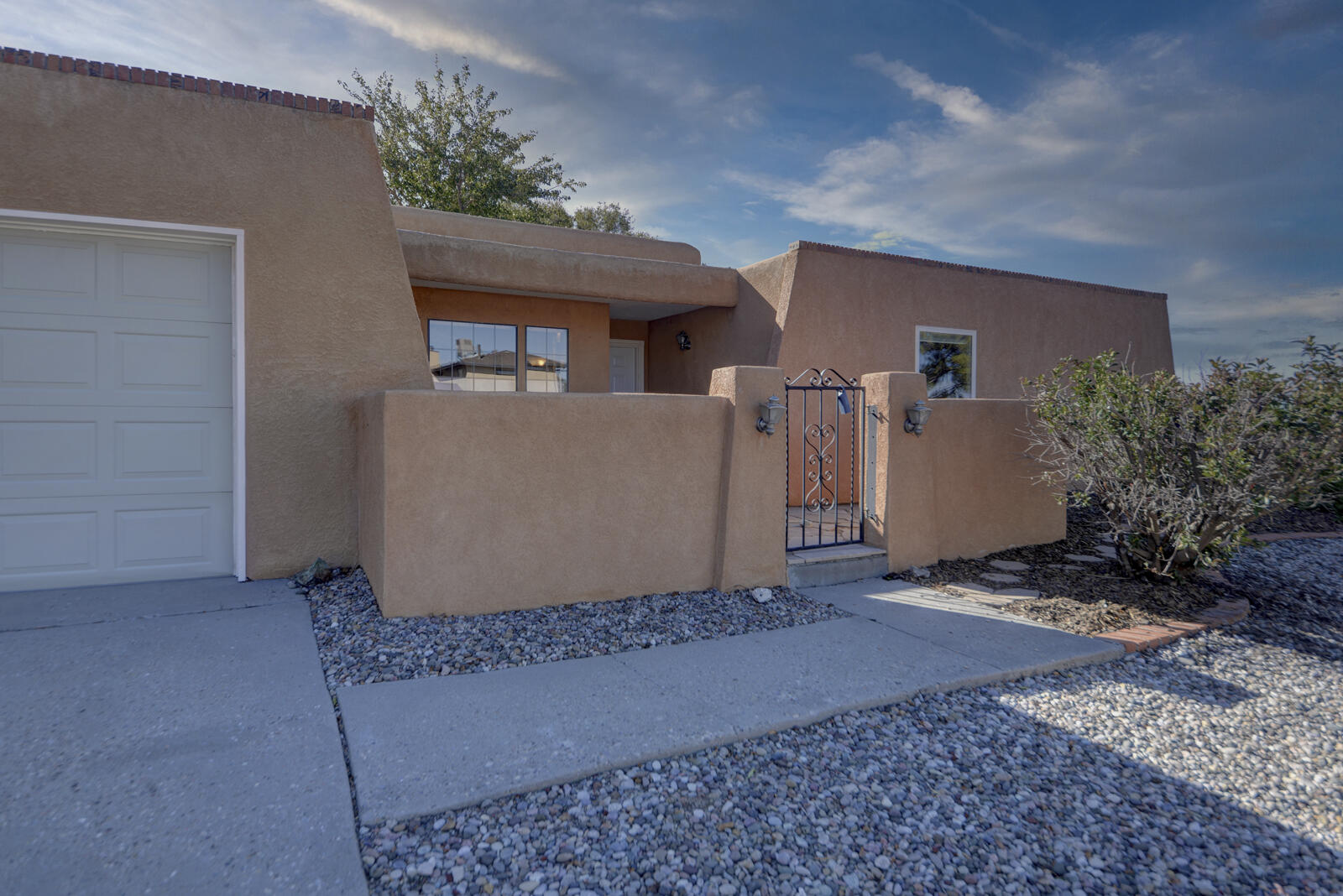 Nestled in the foothills of the Sandia Mountains, this single-story home offers  comfort, convenience, and natural beauty. Located near parks, open space, & walking & biking trails, This home is ideal for those who love outdoor activities. In 2024, the roof received a tune-up, along with a full replacement of the roofing section over the garage.A new stove and electric range were installed in September 2024, with a gas hookup option for future versatility.The home's mechanical systems have been updated, with the furnace and water heater replaced in 2016- 2017, the grassy section of the backyard was enhanced with an underground watering system, significantly reducing water evaporation and boosting absorption making it eco-friendly & efficient. Full remodel of primary bath in 2019.