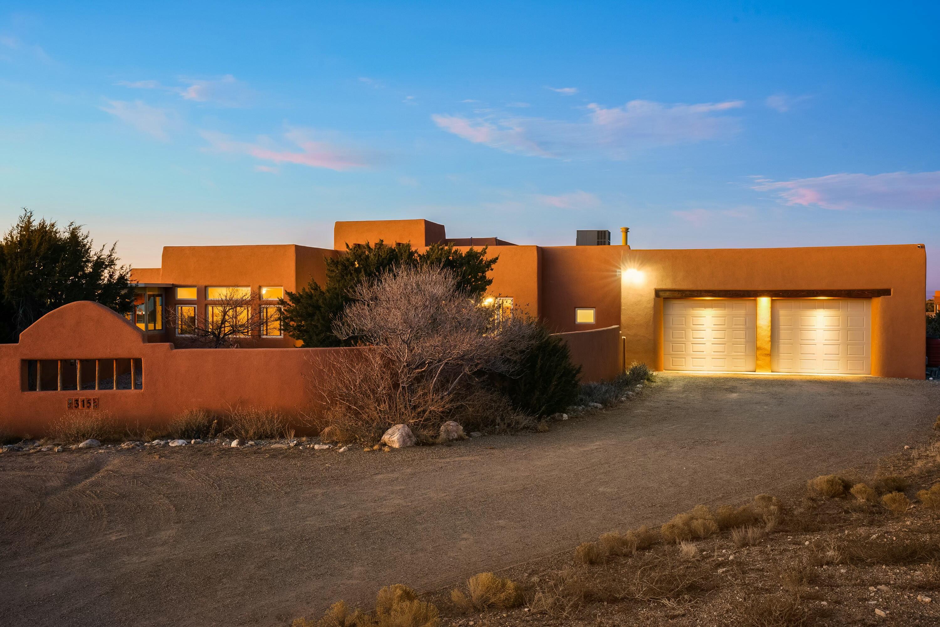 A real beauty with stunning Mountain, mesa and sunset views. Wild horses visit regularly too! Contemporary Southwest design with exposed beam high ceiling, diamond plaster walls, art niches, custom kiva fireplace with wood burning insert. Fabulous kitchen open to the great room, nook, sunroom and formal dining room. Chef's delight with double ovens, gas cooktop, granite and cherry cabinets. Large second living area. Lovely primary bedroom with privacy features an unbelievable sunroom, luxurious bath and huge walk in closet. 2 more bedrooms and Jack & Jill bath on their on private end. Large closets. Owned solar! Garage is huge with area for gym, workshop or storage. Welcoming front courtyard leads to entry with a stunning wood door and fountain. Chicken coop too!