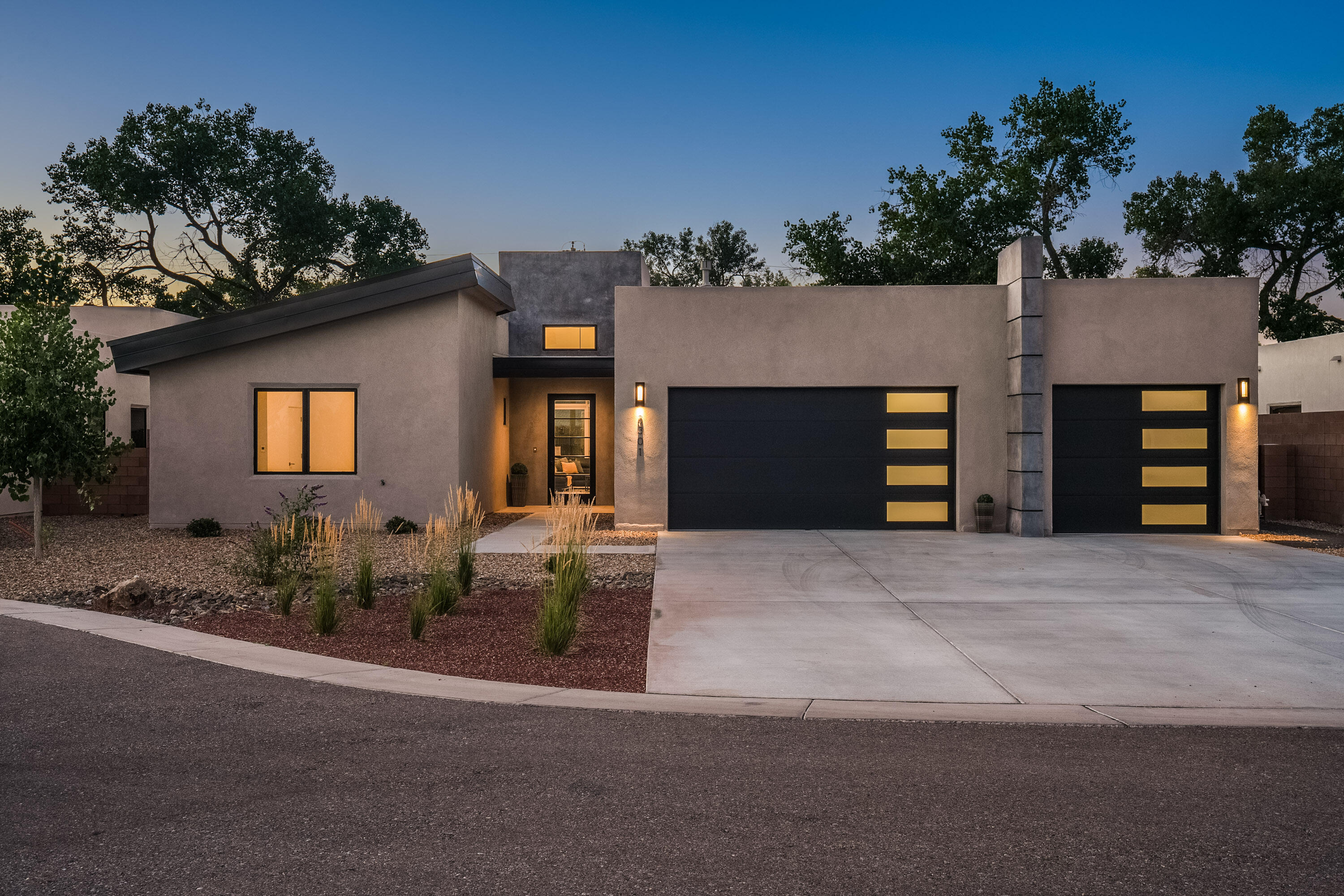 Welcome to this custom home built by the renowned Las Ventanas builders. A contemporary escape located in the exclusive Bosque Antigua gated community along the Rio Grande Bosque greenbelt. Discover serenity on this .25-acre easy landscape lot, boasting a three-bedroom, two-bathroom home, with a three-car finished garage with epoxy flooring and natural light for flex space opportunities. Every detail has been carefully designed, and the home proudly carries the Silver level Green Build New Mexico certification, ensuring a commitment to energy efficiency for sustainable, cost-effective utilities. Built in 2023, this modern masterpiece seamlessly blends architectural innovation with the natural beauty of its surroundings.