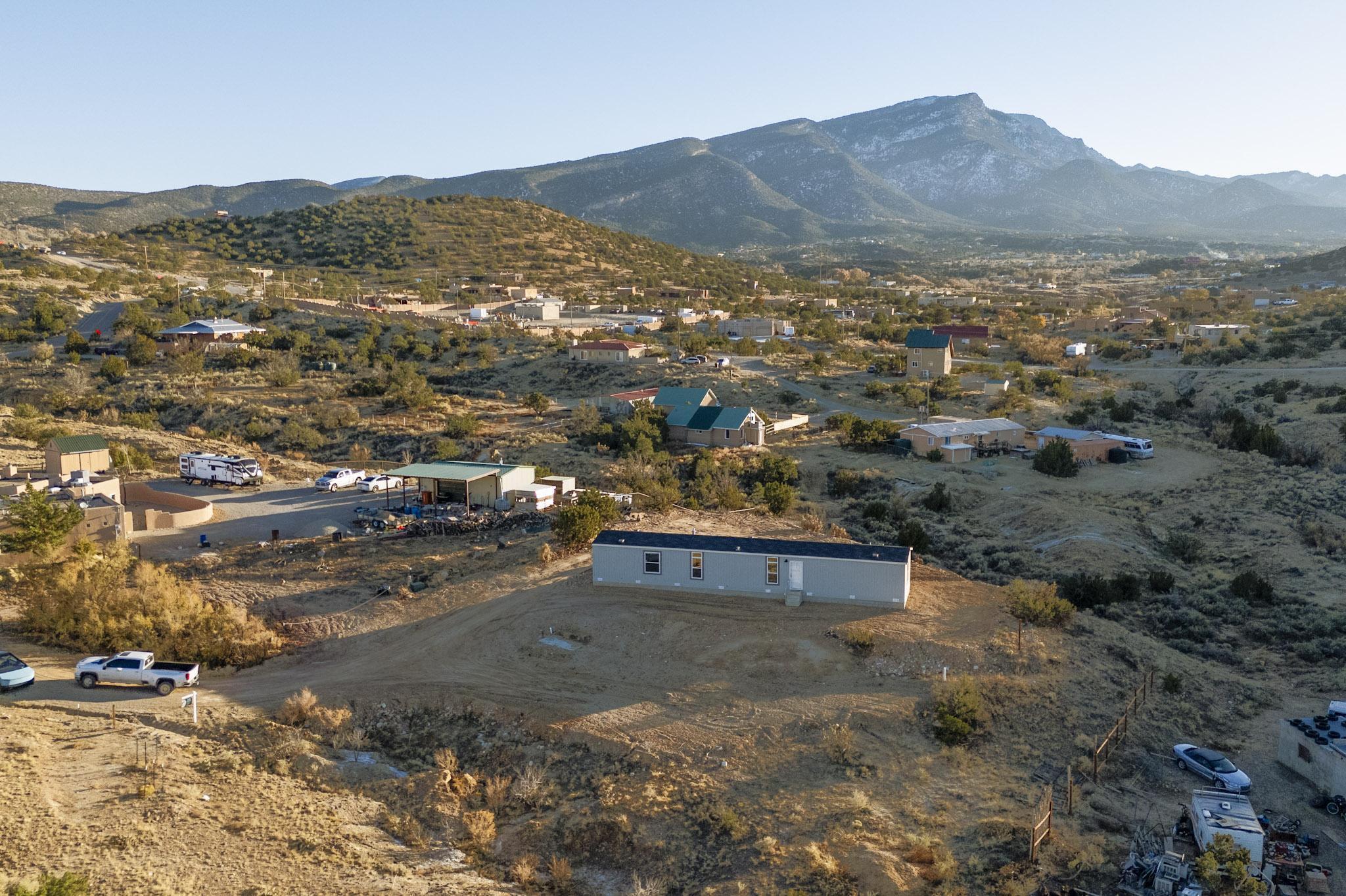 3 bedrooms and 2 bathrooms, this home is perfect for families or those seeking extra space.Breathtaking Views, Experience stunning sunsets and mountain scenery right from your property. This property has a lot of potential, ready for the perfect homeowner to add their personal touch and make it their own. Nestled in a peaceful area of Placitas, you'll enjoy the tranquility of rural living while still being close to local amenities and attractions. Don't miss out on this incredible chance to own a slice of paradise in Placitas!