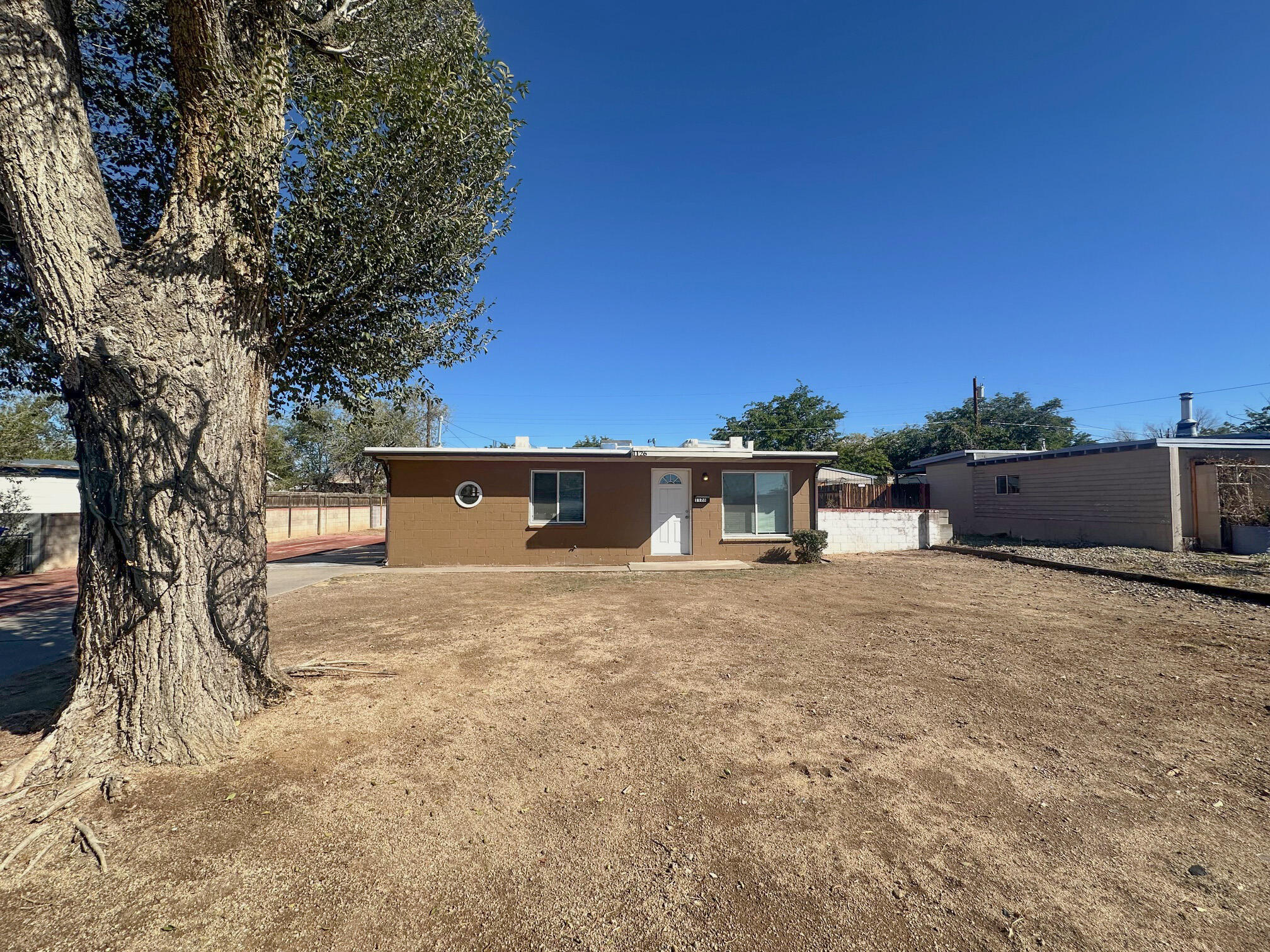 This 2 bedroom, 1 bath home is centrally located just several miles from Uptown shopping, dining and entertainment. The living room and bedrooms have wood tongue and groove ceilings. The large lot is the perfect blank canvas to design your very own outdoor retreat.