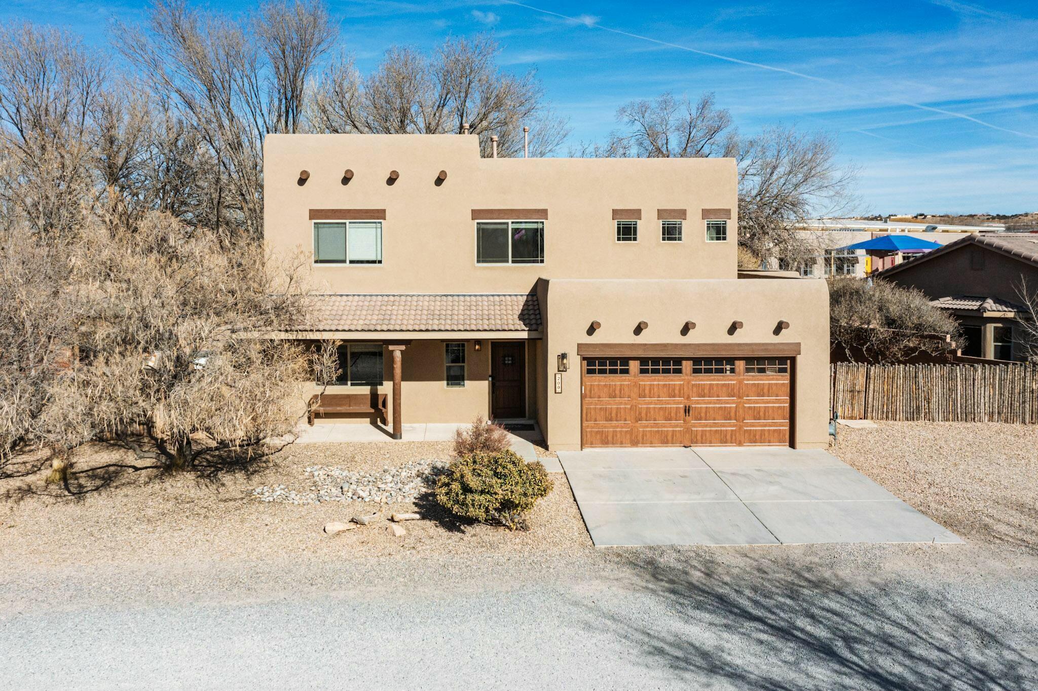 Experience serene living in this beautiful 4-bed, 3-bath home perfectly situated next to open space & farmland, with easy access to I-25, Albuquerque, or Santa Fe. The heart of the home is a modern kitchen filled with natural light that flows seamlessly into a spacious great room. A separate living area provides space for gatherings, while the versatile loft can be an office, play, or fitness area. This home has been thoughtfully updated, featuring new roof, stucco, garage door, AC units, granite countertops & more! Step outside to enjoy two covered patios shaded by mature cottonwood trees and take in the peaceful surroundings. This home offers the best of modern comforts & a serene retreat. Discover the perfect blend of convenience, tranquility, and style.