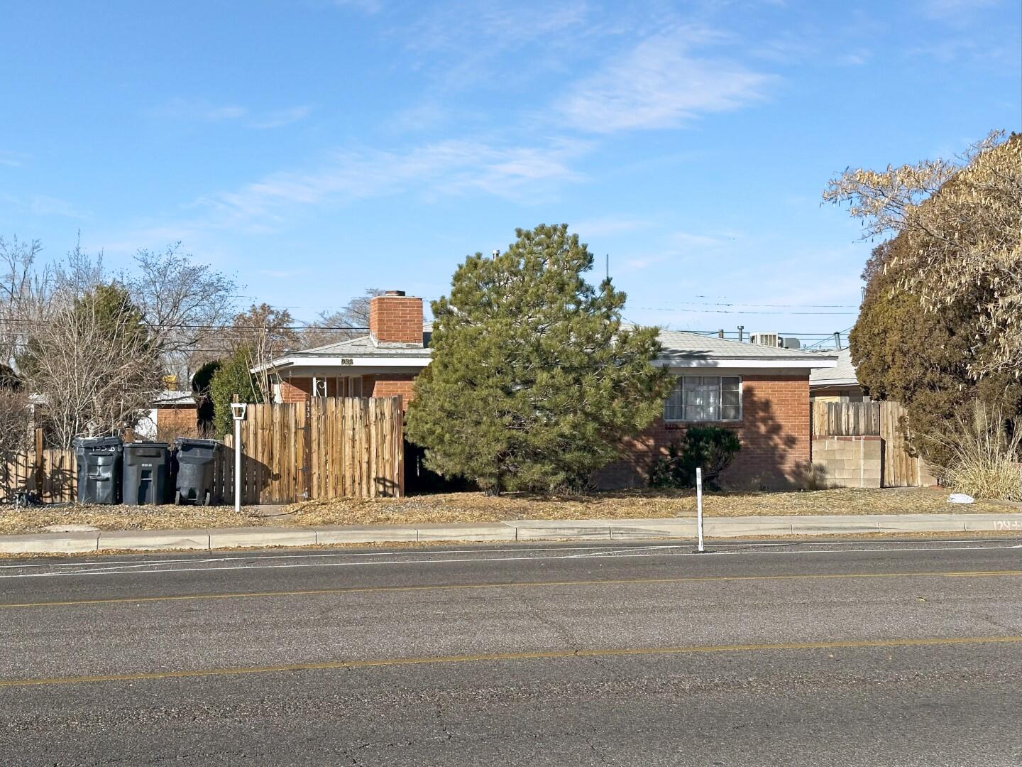 Well-maintained triplex with stable tenants. Brick exterior, shingle roof. Large 2BR/1BA units approx 1000 SF each. Hardwood floors, vinyl tile in baths and kitchen. All wood cabinetry in kitchens, all appliances included.   Central heating and evaporative cooling. Brick fire places in the two end units. W/D in each unit.  4 covered parking spaces accessed from alley. Each apt has a storage closet and a private backyard. 2 tenants not currently at market rent. APOD available upon request. Please do not disturb tenants. Showing to be arranged upon accepted offer.