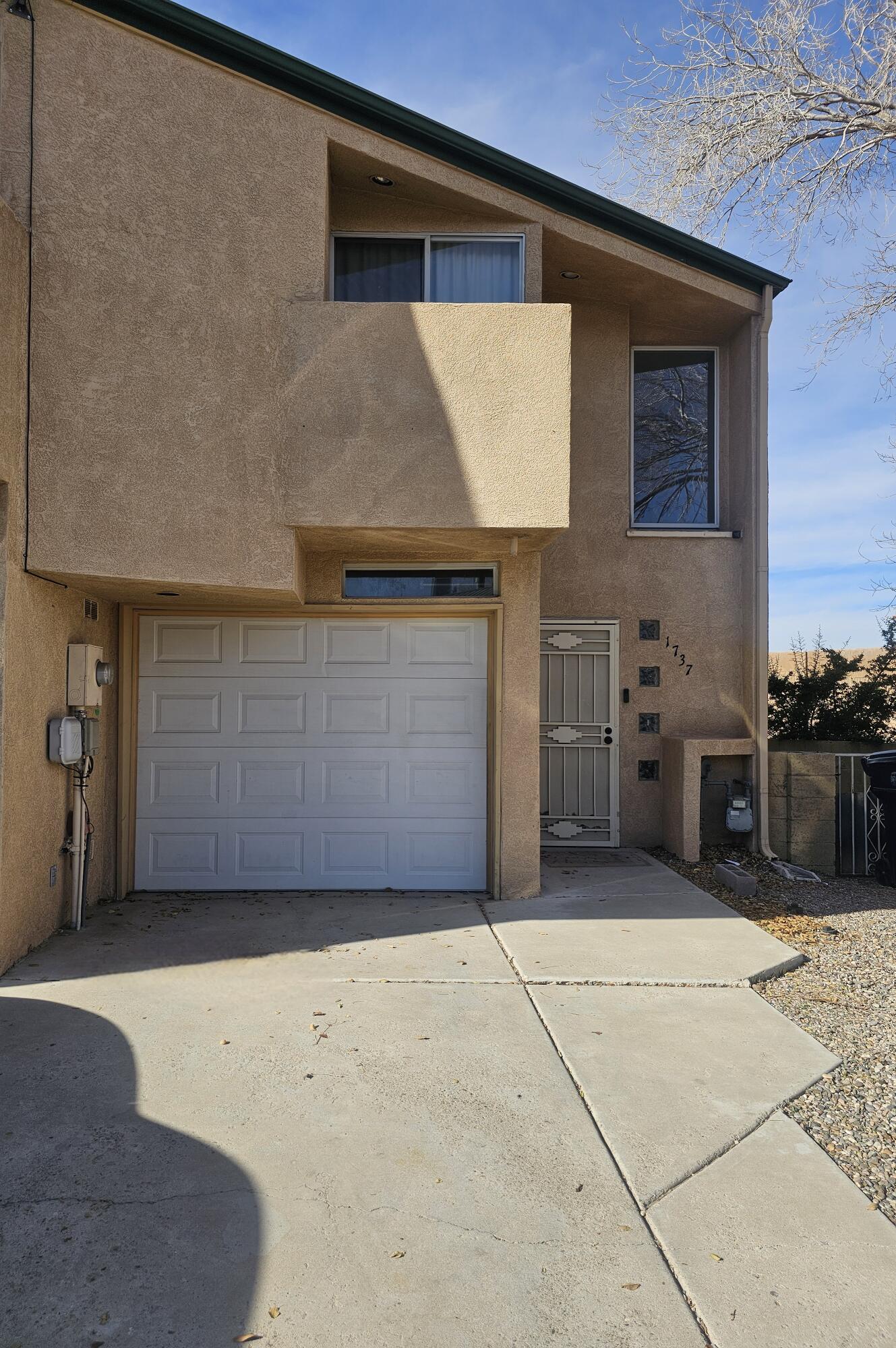 Walk into this updated contemporary, open concept living area that is welcomed by a flood of light. Enjoy a cup of coffee at the breakfast nook or host a game night using the multiple seating areas. A lovely half bath and laundry room with lots of storage is also located on the lower level. Upstairs, you'll be greeted by a very spacious primary bedroom with 3 closets, a vaulted ceiling, and a private balcony. Unwind in the custom tile shower off of the primary bedroom. Guest bedrooms have their own walk-in closets and private balconies. An additional full bath is upstairs. There is no lack of storage in this home! Stay cool this summer with refrigerated air. Corner lot provides room for a larger yard.